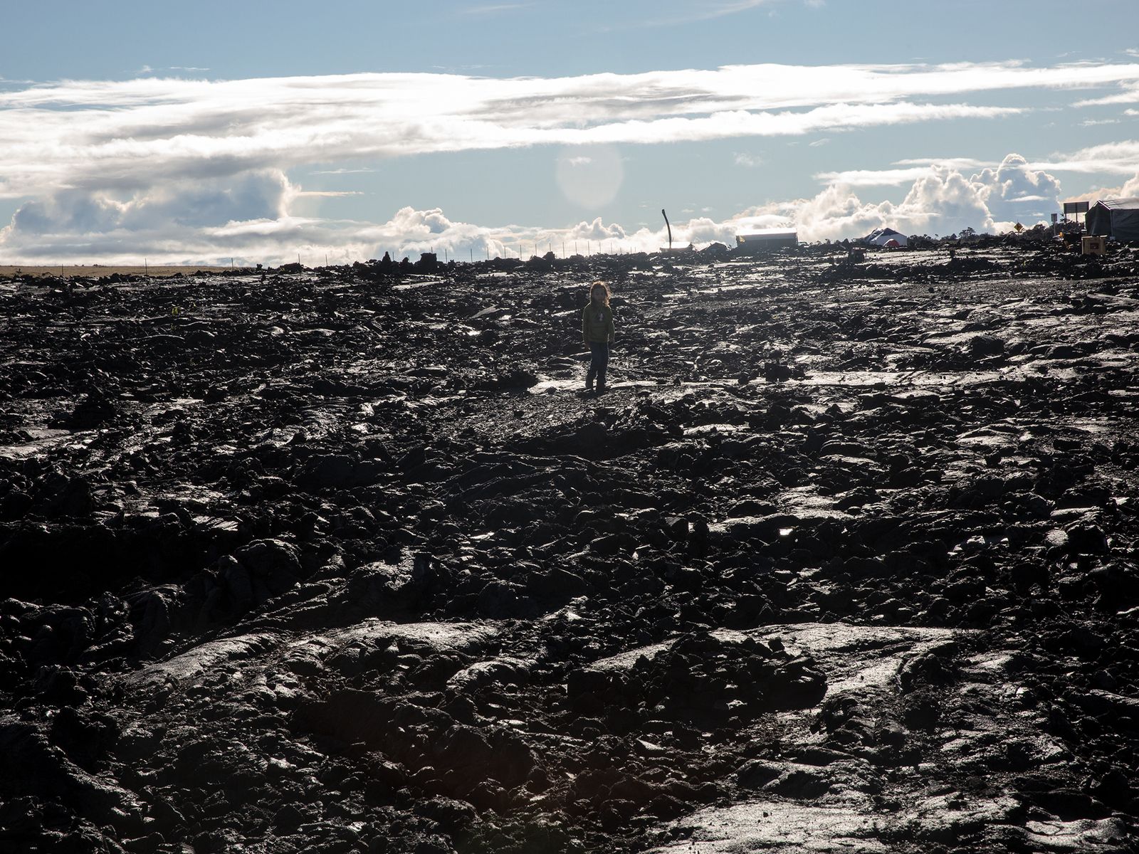© Molly Peters - A child wanders out on the lava flow.
