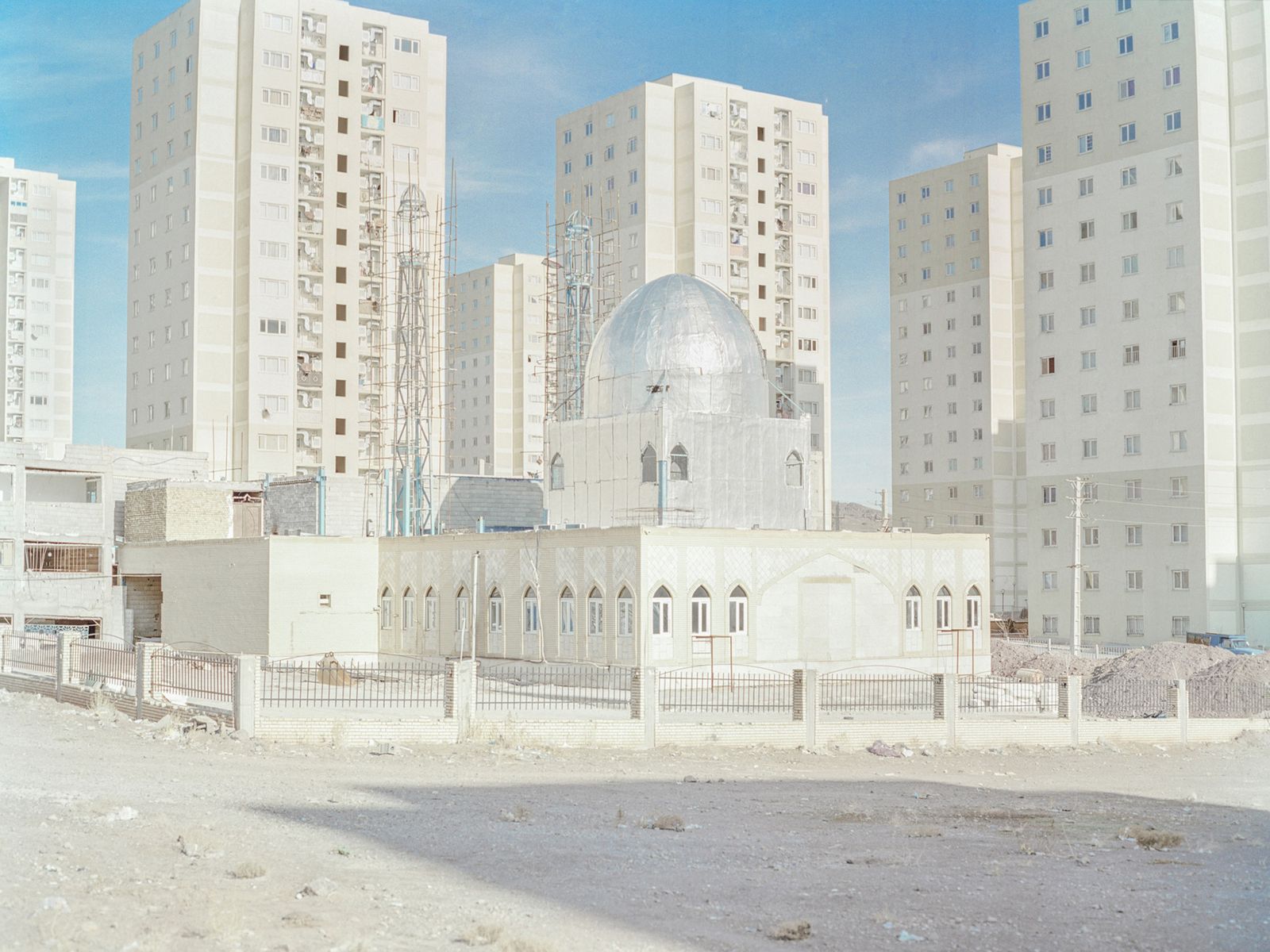 © Hashem Shakeri - A mosque located among tall buildings in the new town of Parand. Parand is located 30 km southwest of Tehran province.