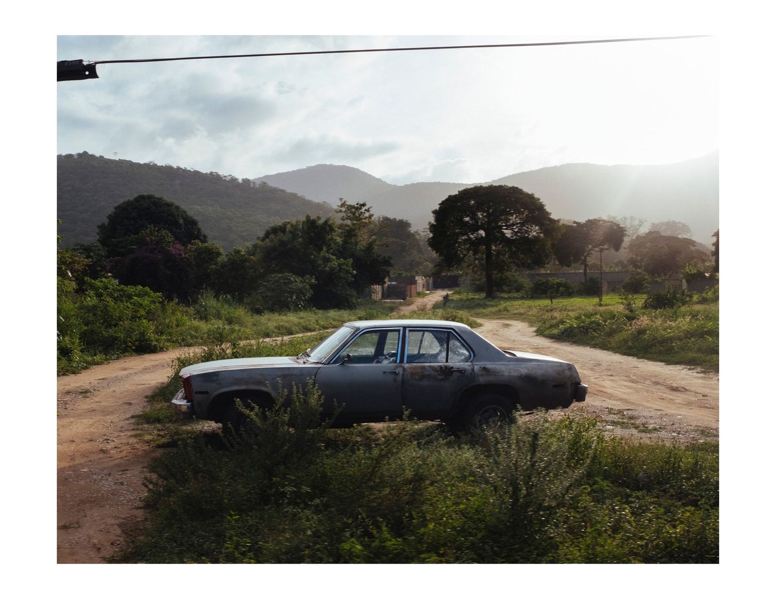 © Andrea Hernández Briceño - A parked vehicle in the middle of a road in rural town Patanemo, Venezuela, on August 9, 2018