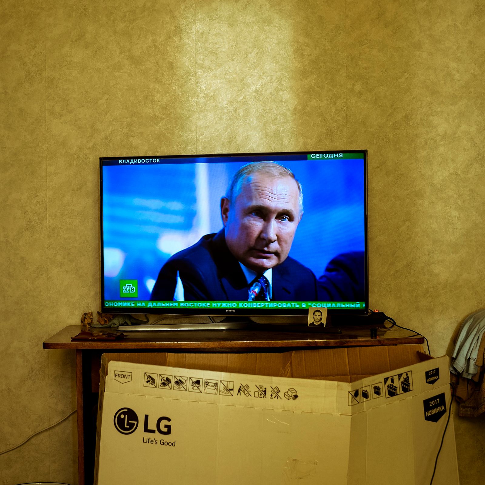 © Maria Quigley - Vladimir Putin on the television screen in Babushka's bedroom. An LG 'Life's Good' TV box leans against the cabinet.