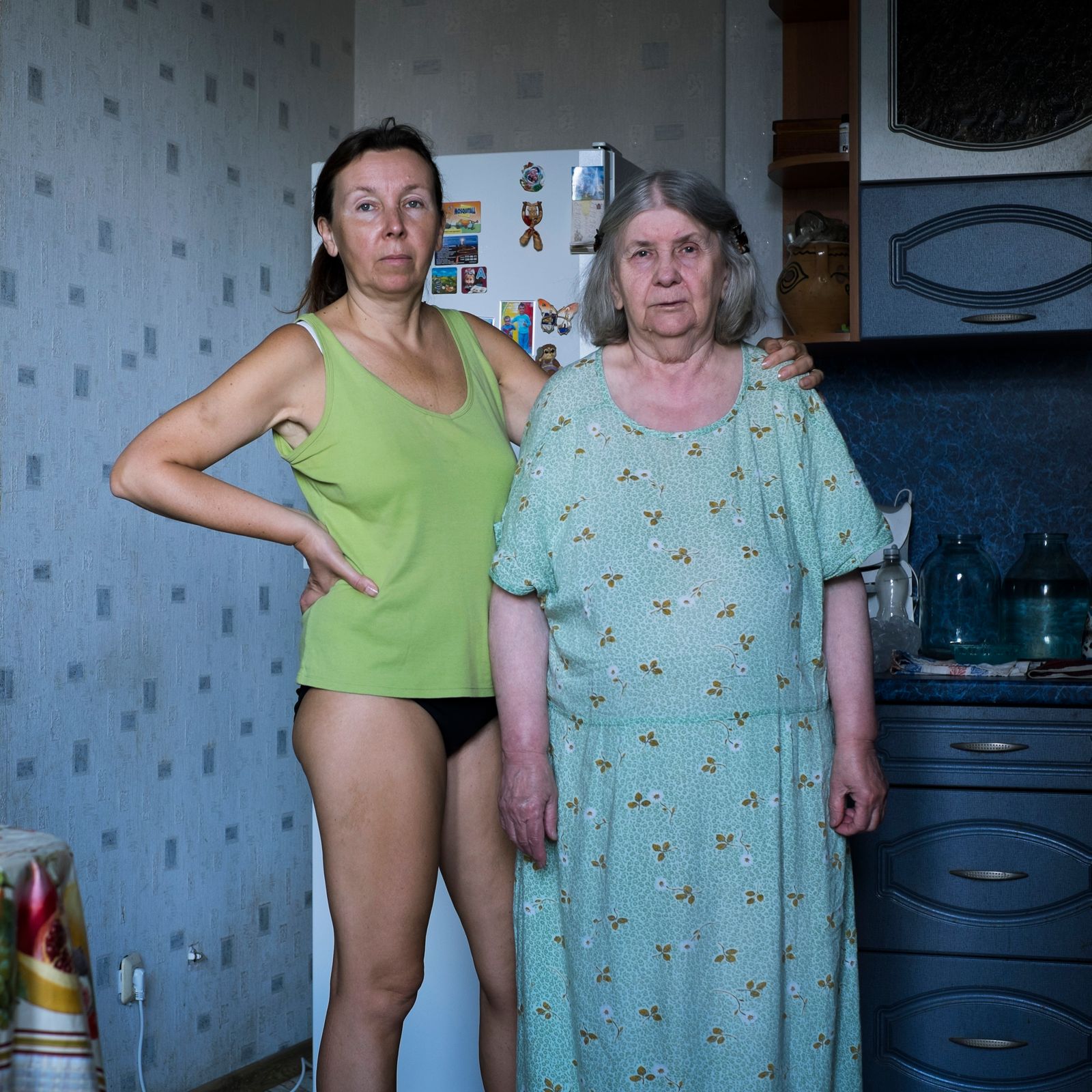 © Maria Quigley - Svetlana and Babushka stand in the kitchen.