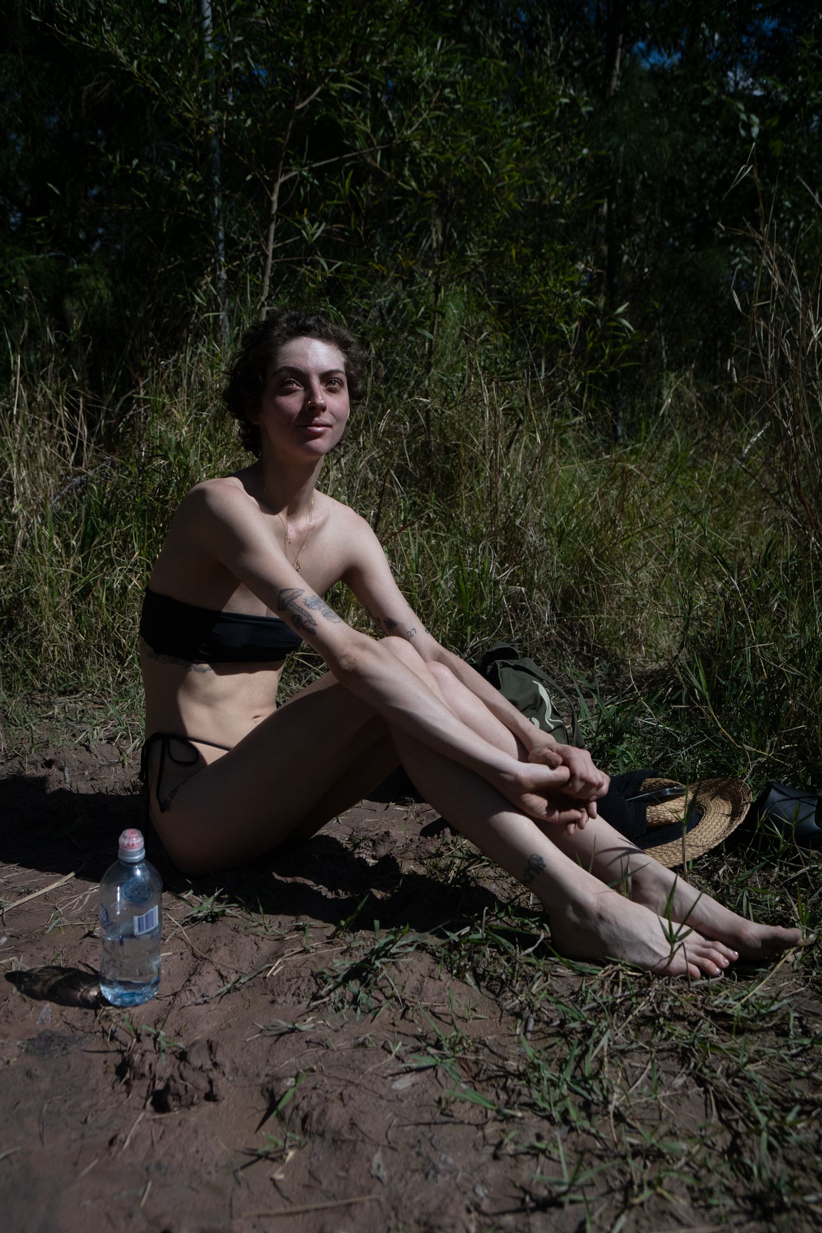 © Tajette O'halloran - A girl 'having a sad day" sits on the bank after a swim