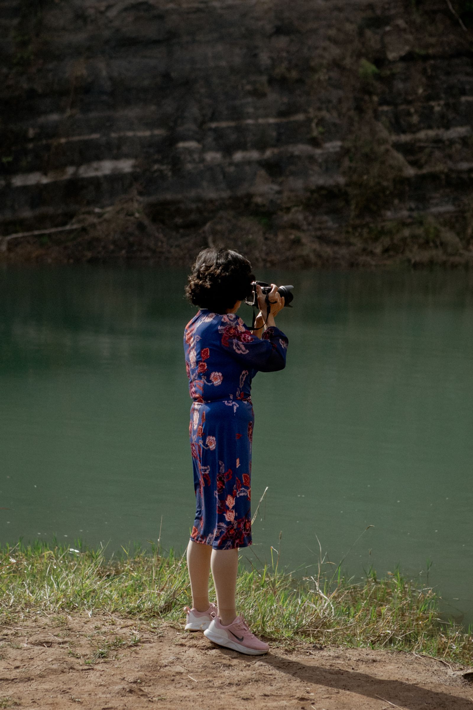 © Tajette O'halloran - A Japanese woman taking photos of swimmers