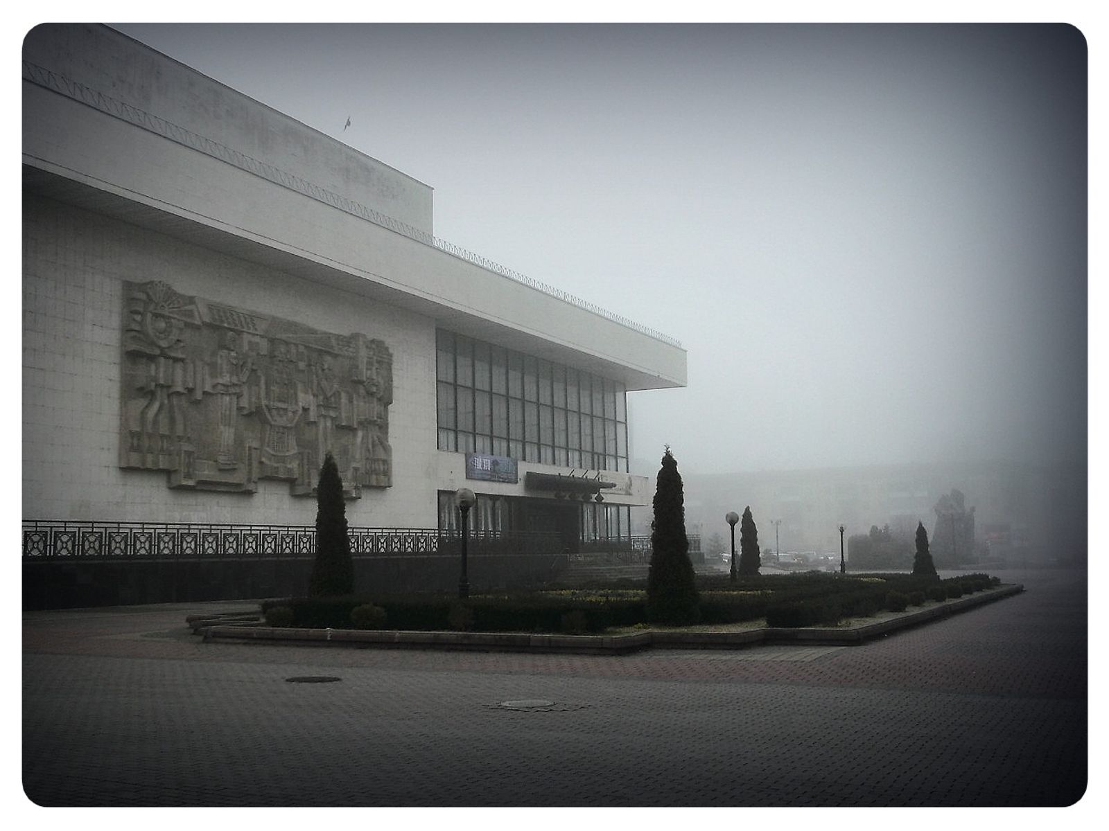 © Andrei  Kolyaskin - Foggy  morning  in  Memorial  Square  of  Ivano - Frankivsk  City , Ukraine .