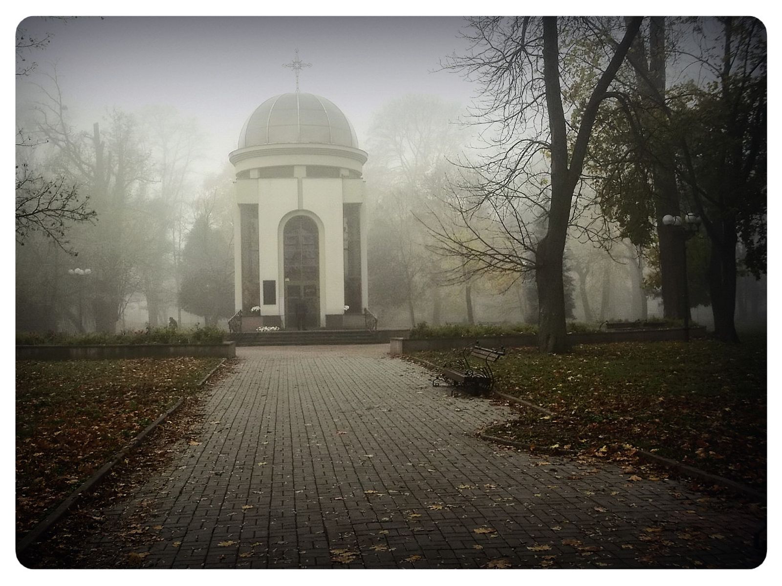 © Andrei  Kolyaskin - Foggy  morning  in  Memorial  Square  of  Ivano - Frankivsk  City , Ukraine .