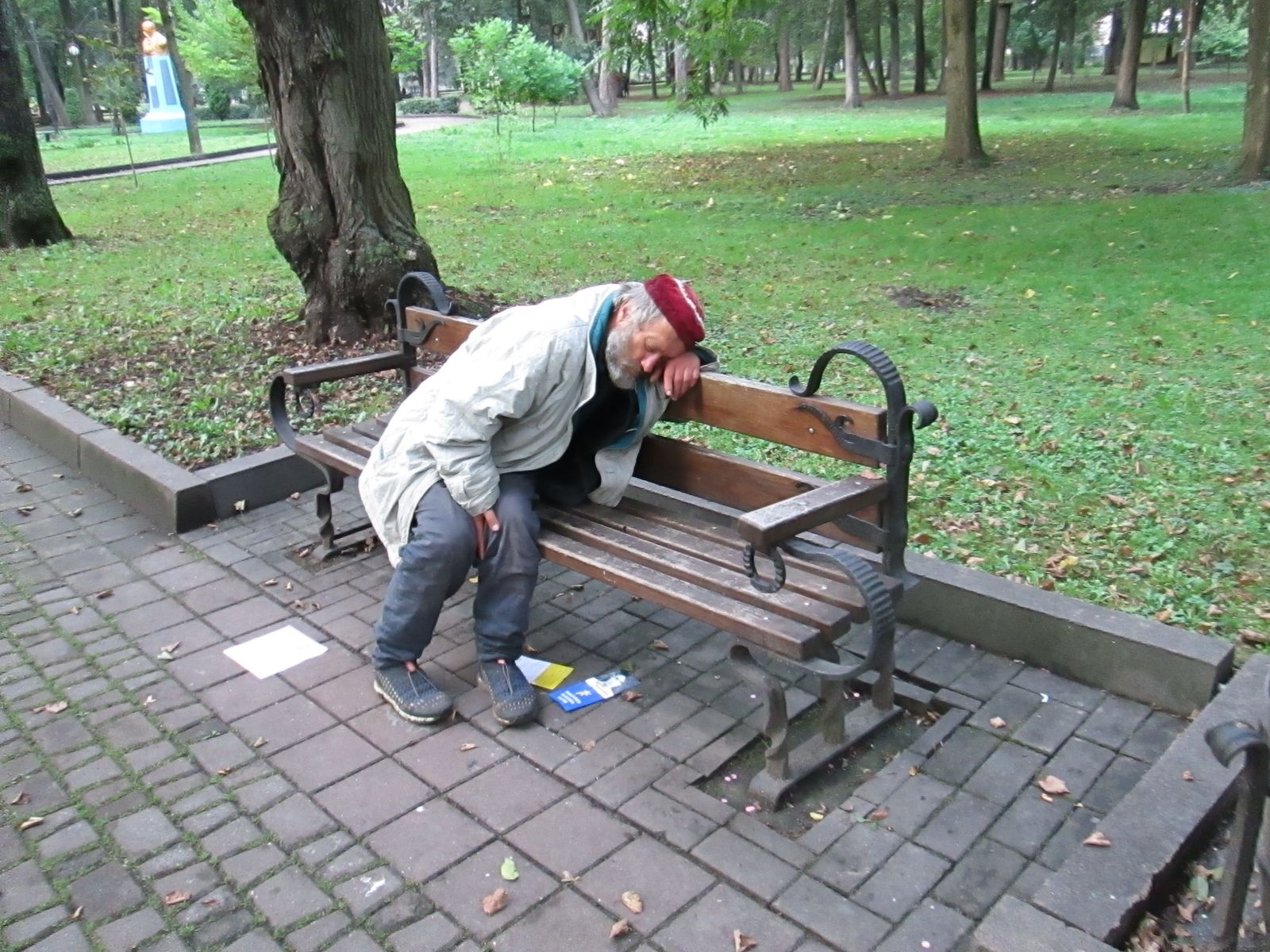 © Andrei  Kolyaskin - Drunkard  on  the  central  park  of  Ivano - Frankivsk  City , Ukraine .