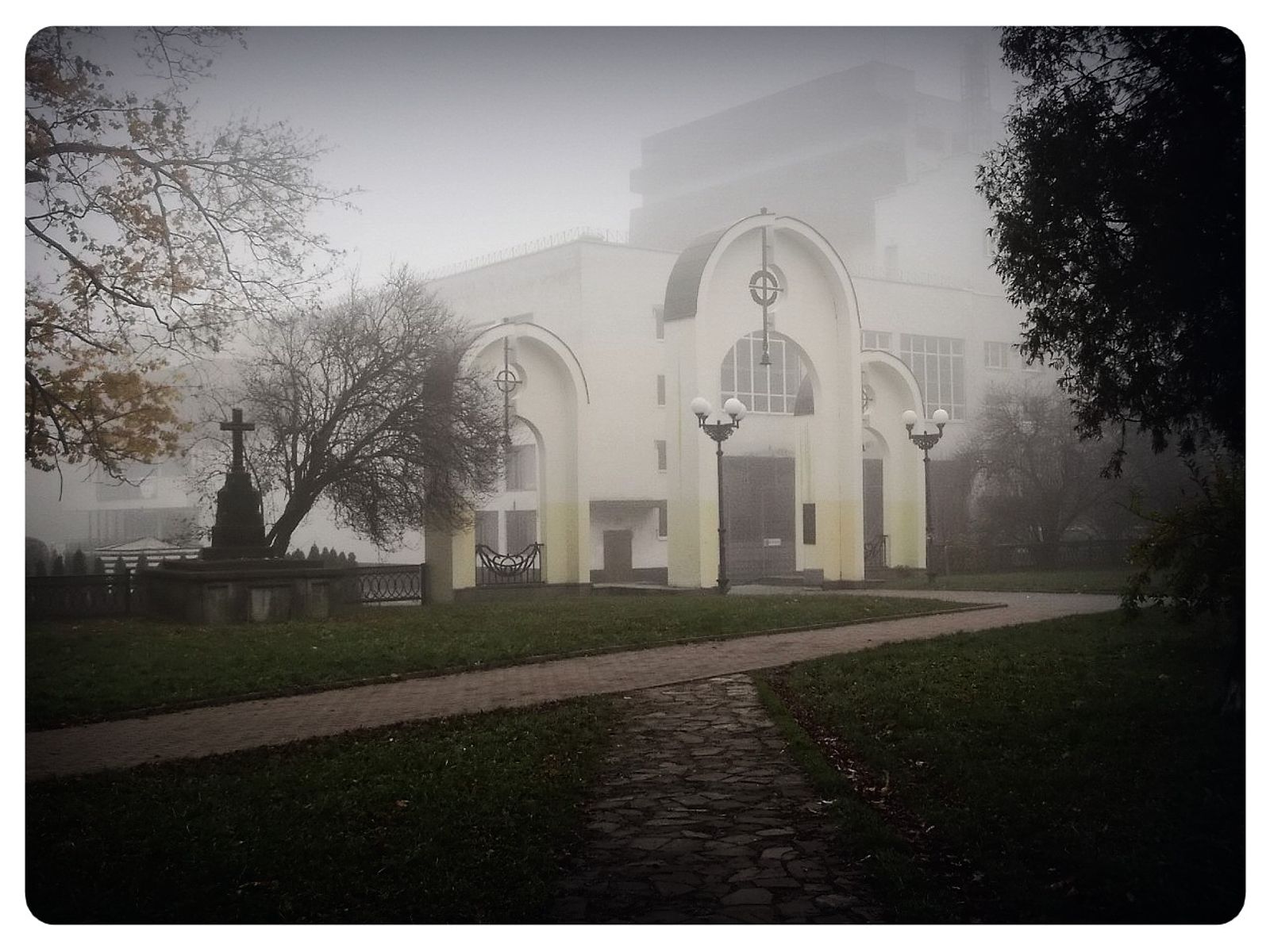 © Andrei  Kolyaskin - Foggy  autumn  morning  on  the  Memorial  Square  of  Ivano - Frankivsk  City , Ukraine .