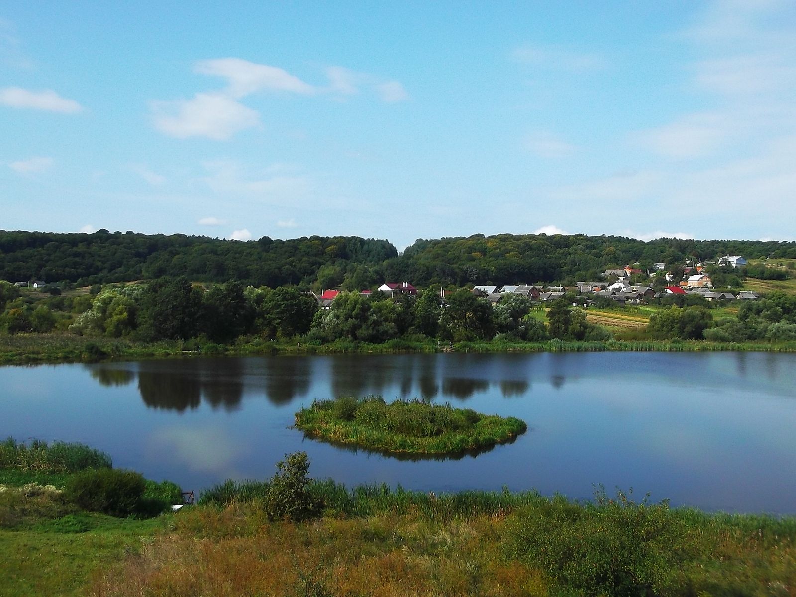 © Andrei  Kolyaskin - Lake  near  Svirzh  Castle  from  15th  century  in  village  Svirzh  of  Lviv  region , Ukraine .