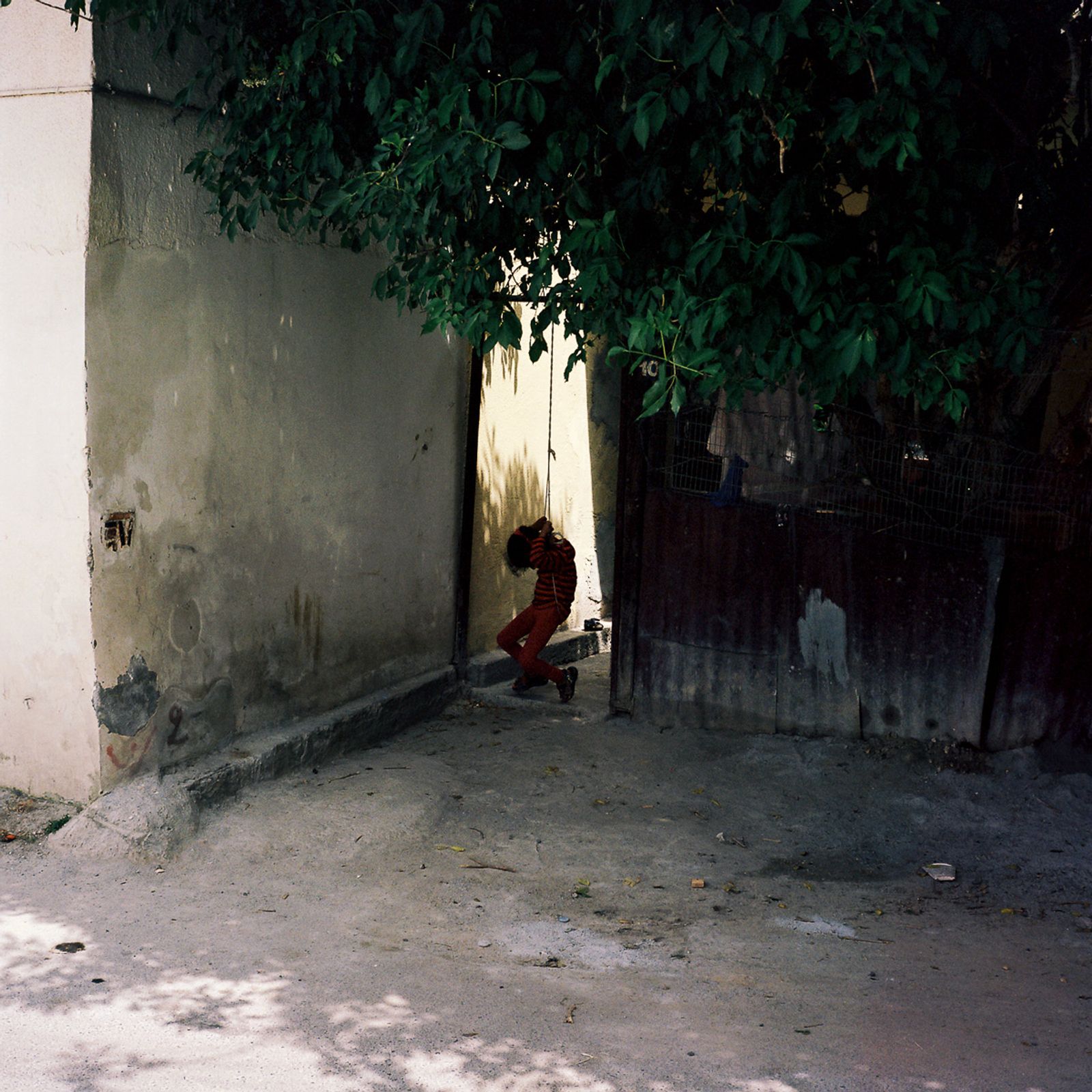 © Radu Diaconu - Lefkosa, TRNC, April 2019. A young girl plays inside her garden in the old city of Lefkosa, TRNC.