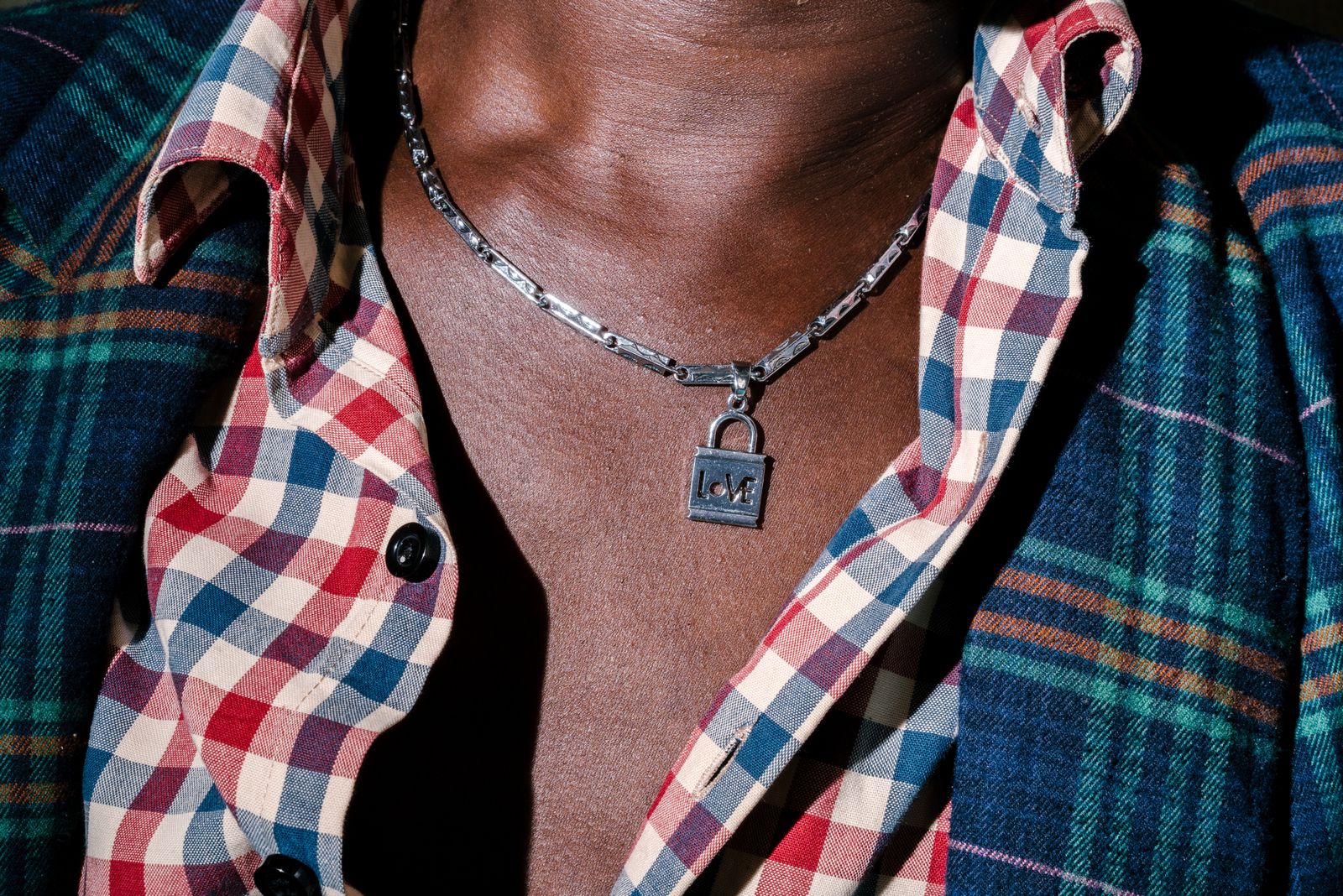 © Jake Naughton - Sweet Love, a transgender woman, poses for a portrait wearing a necklace from her partner.