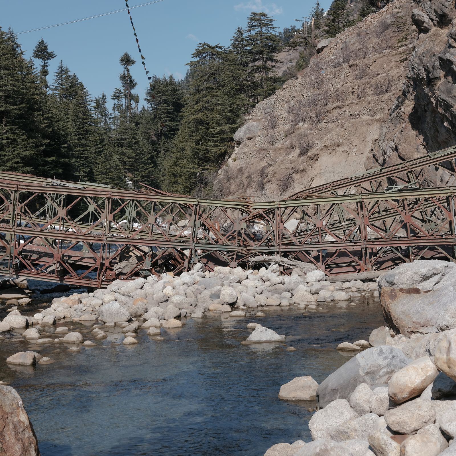 © Ashutosh Shaktan - A bridge in Batseri, Kinnaur, lies in ruins after a landslide here claimed the lives of 11 tourists.