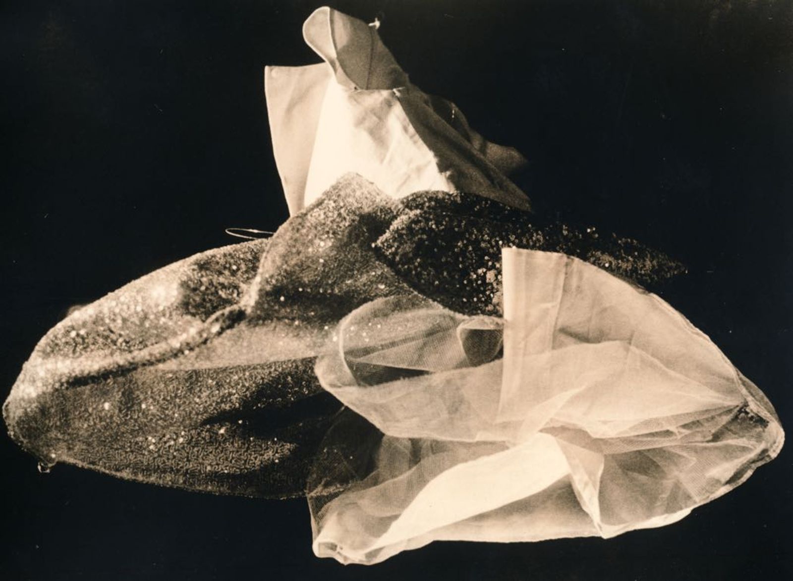 © Jo Stapleton - Child's party dress lit and shot from below (Lith print)