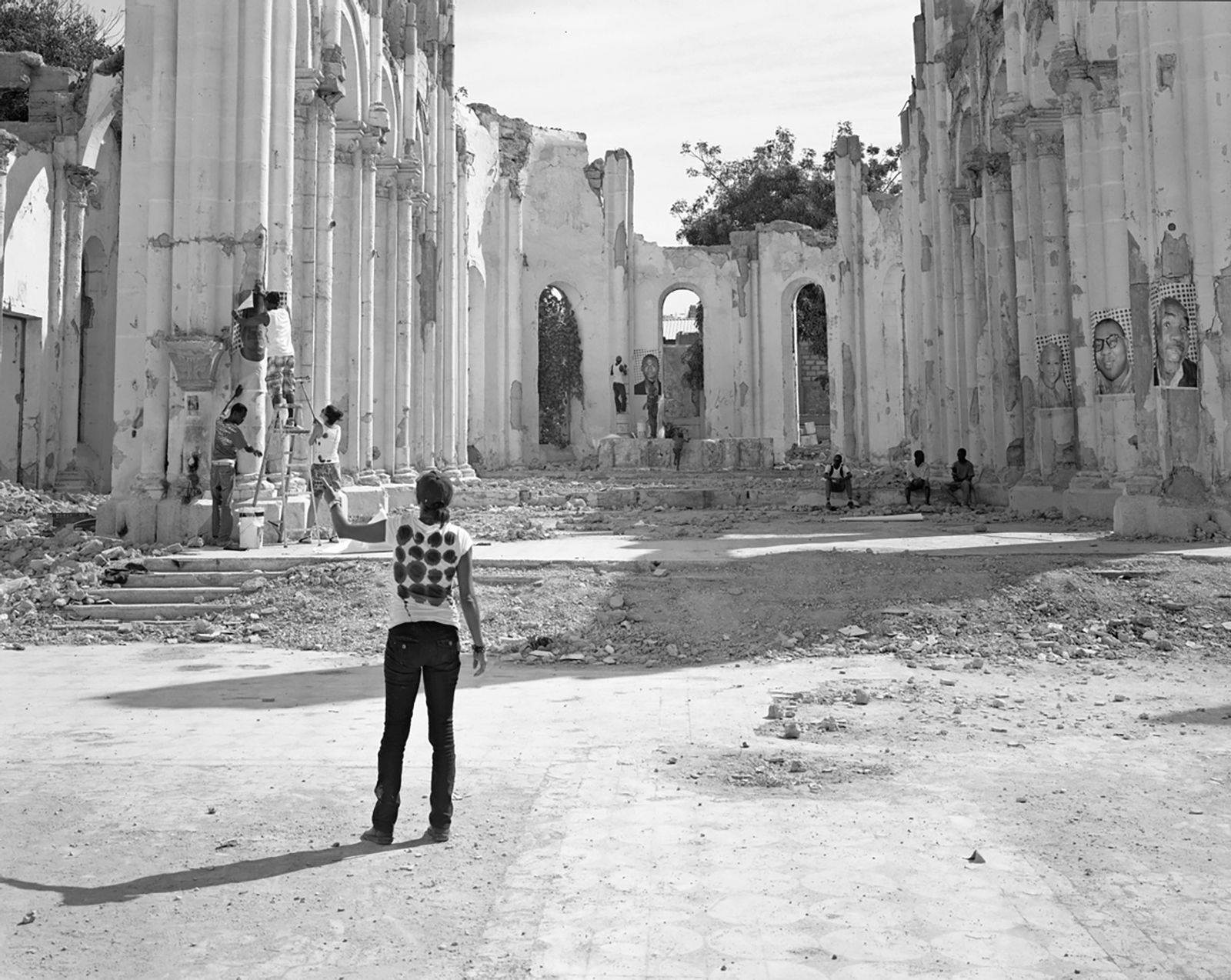 © Laura Heyman - Volunteers Installing JR’s “Rising Souls Haiti”, Cathédrale Notre-Dame de Port-au-Prince, 2012