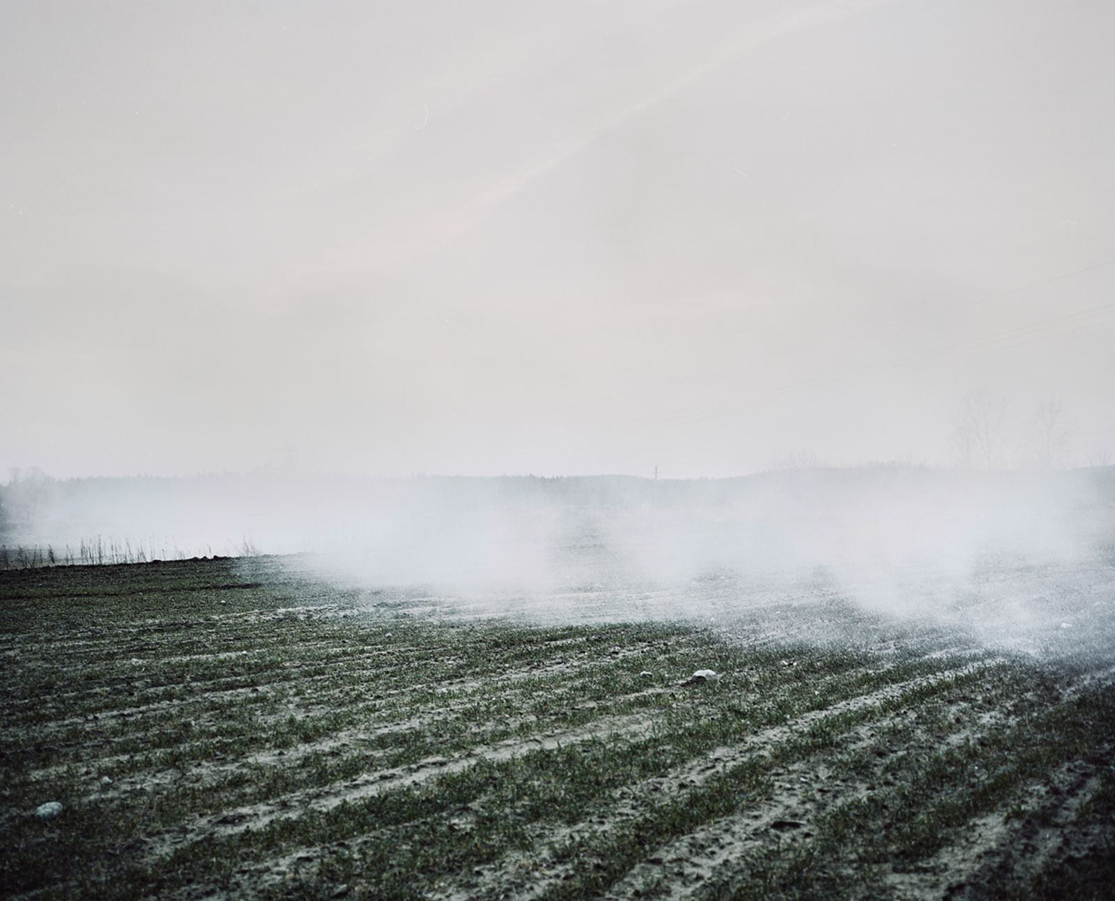 © Jasper  Bastian - Clouds of smoke from an old farm building burning down in Stalgonys.Stalgonys, Lithuania, 2015.