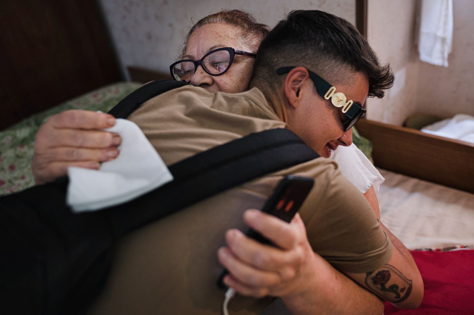 © Diana Bagnoli - Salvatore hugs his granmother in her house. They're are highly attached.