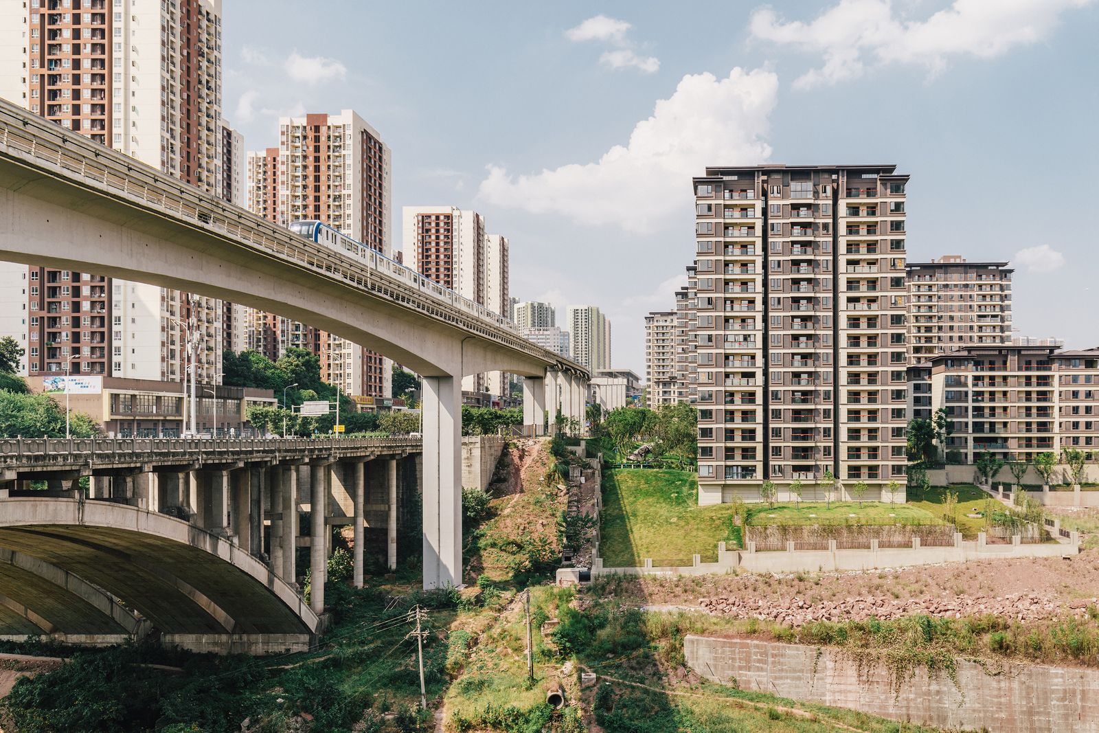 © Tianhu Yuan - The new building meets the old terrain under the bridge here.