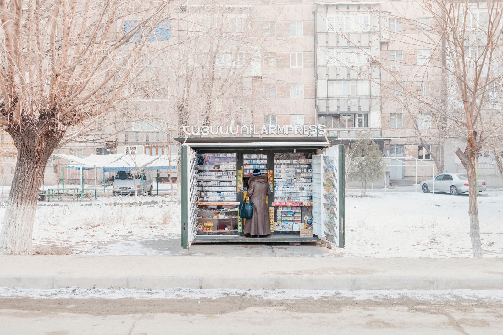 © Stefano Morelli - Metsamor, Armenia. A woman buys a newspaper at a newsstand.