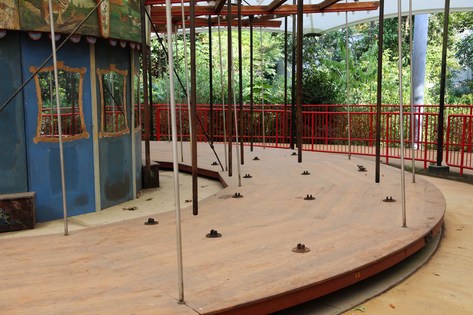 © Isabelle Mitchell - An old carousel stripped of its animals and fenced off, once a communal joy. It’s been in this state since June of 2025.