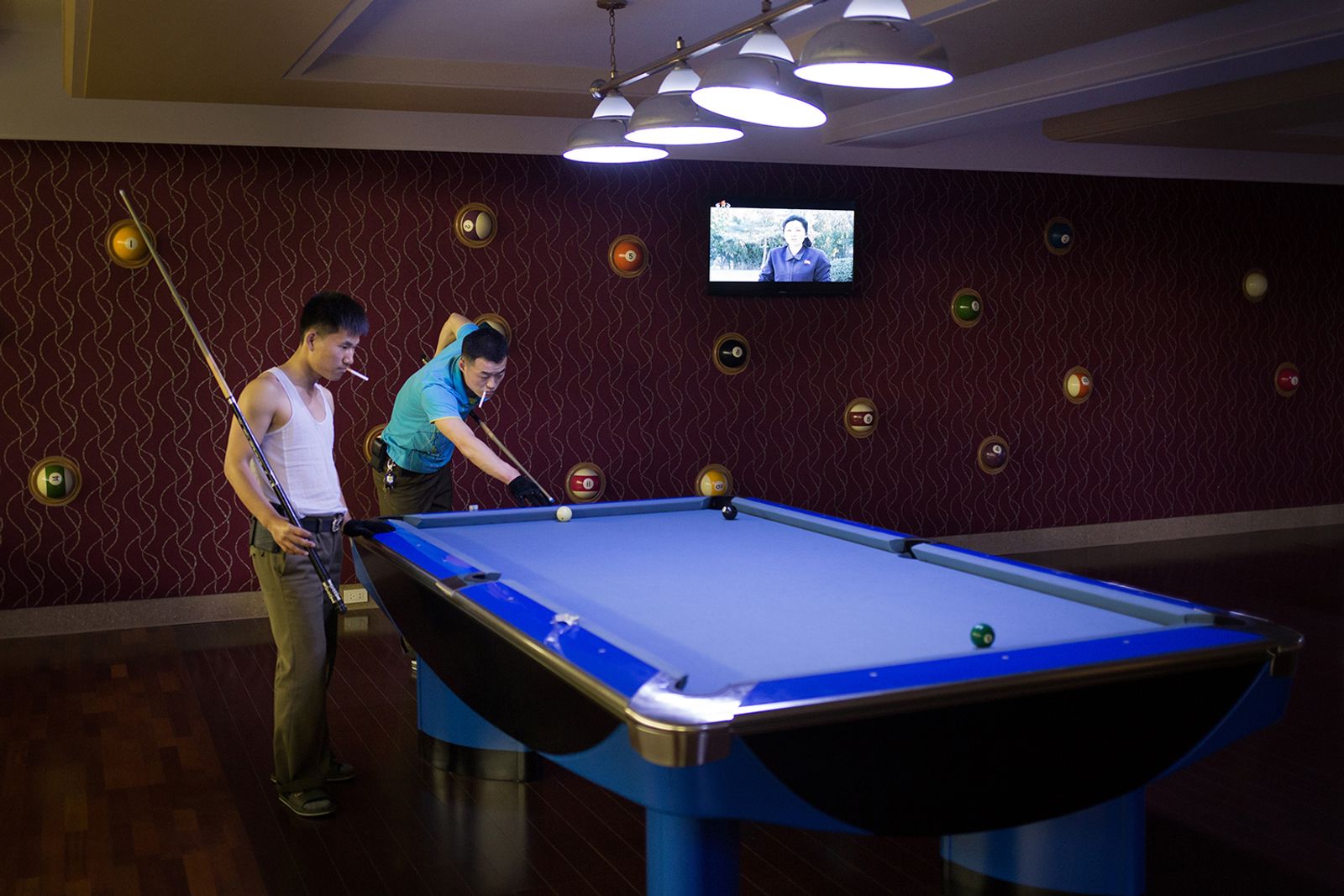 © Filippo Venturi - Koreans playing billiard inside “Munsu” aquatic park, in Pyongyang.
