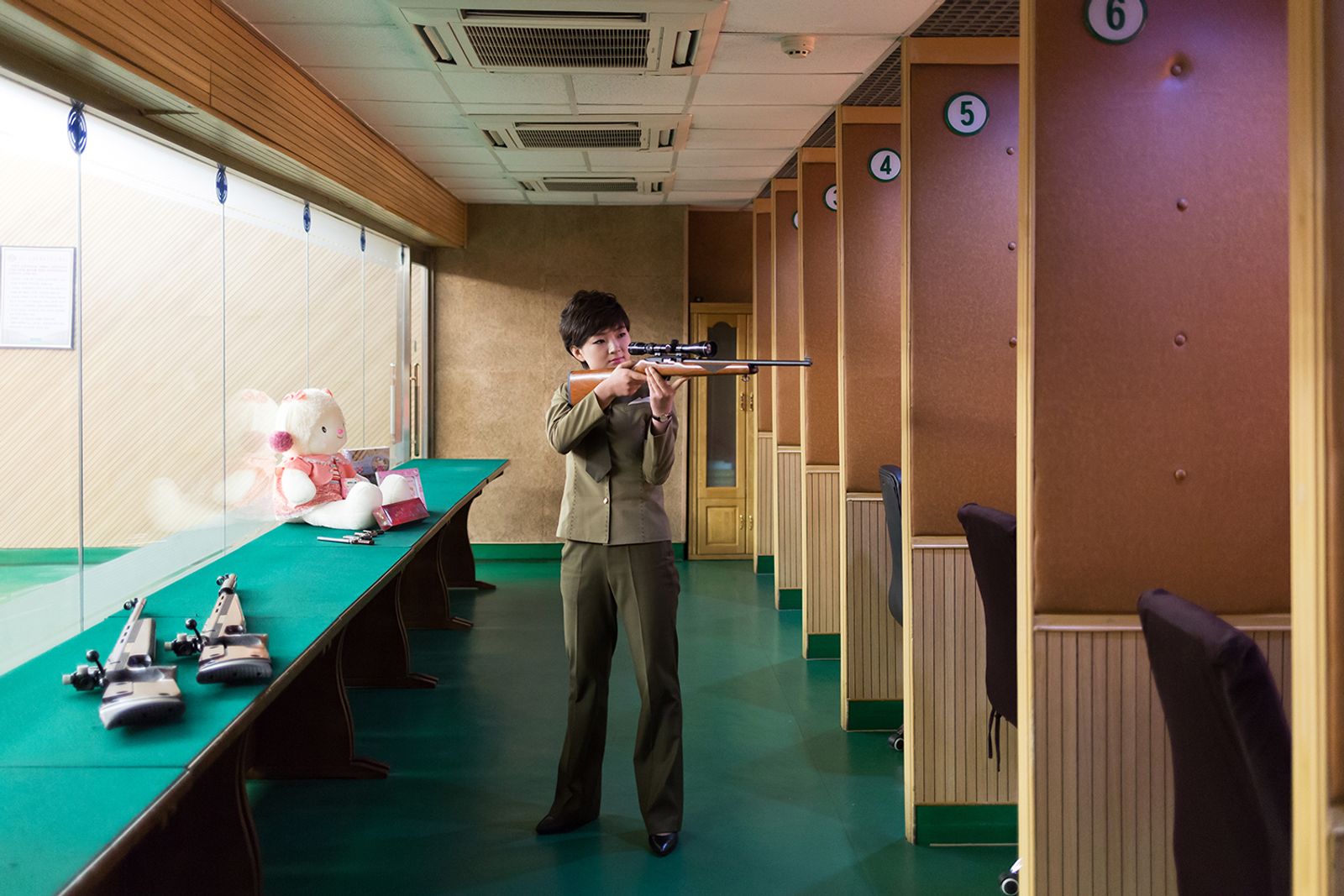 © Filippo Venturi - Kim Hyang, 22 years old, works at the "Meari Shooting Range" of Pyongyang.