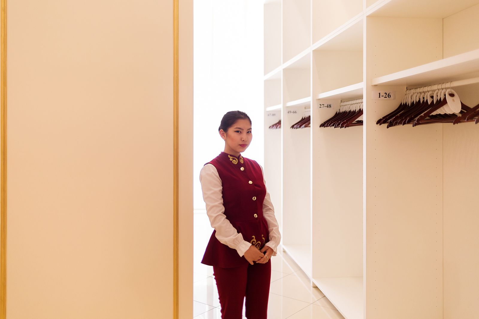 © Filippo Venturi - Coat check girl in Astana Opera, Astana’s opera house opened in 2013.