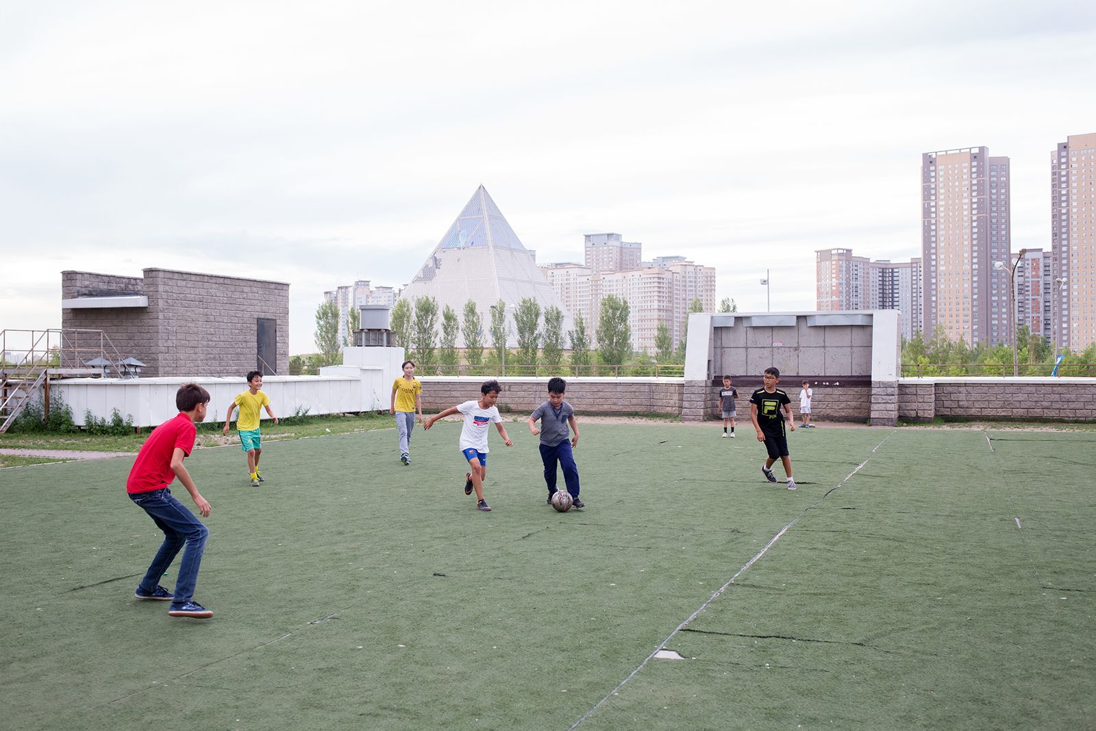 © Filippo Venturi - Boys playing football in a courtyard in a working-class neighbourhood not far from the modern city centre, in Astana.