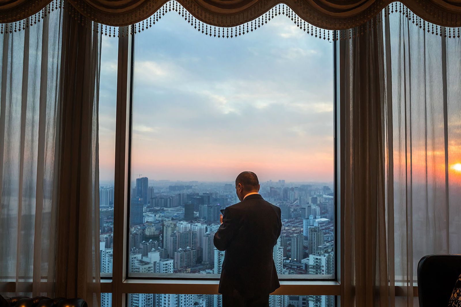 © Matjaz Krivic - A Chinese APG bussiness man after his meeting at the luxury hotel in Shanghai, China.