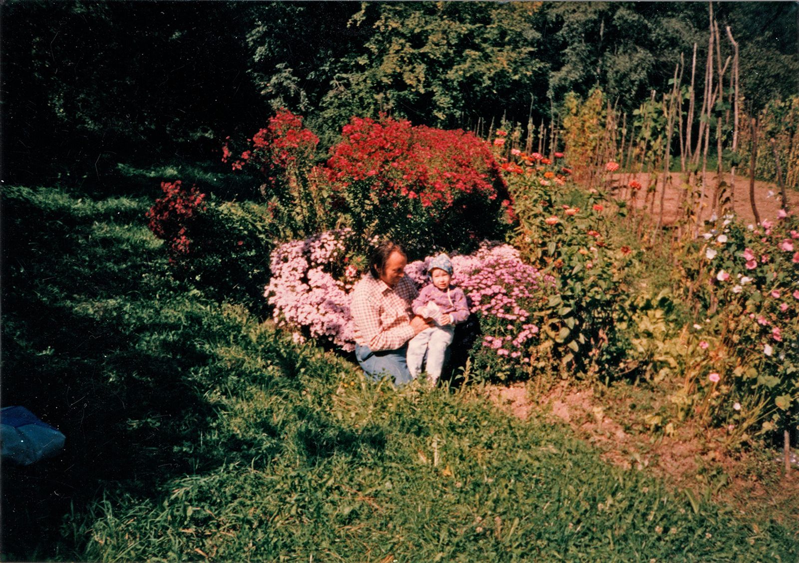 © Lucija Rosc - Me and my grandpa at my grandparents garden (cca 2000)
