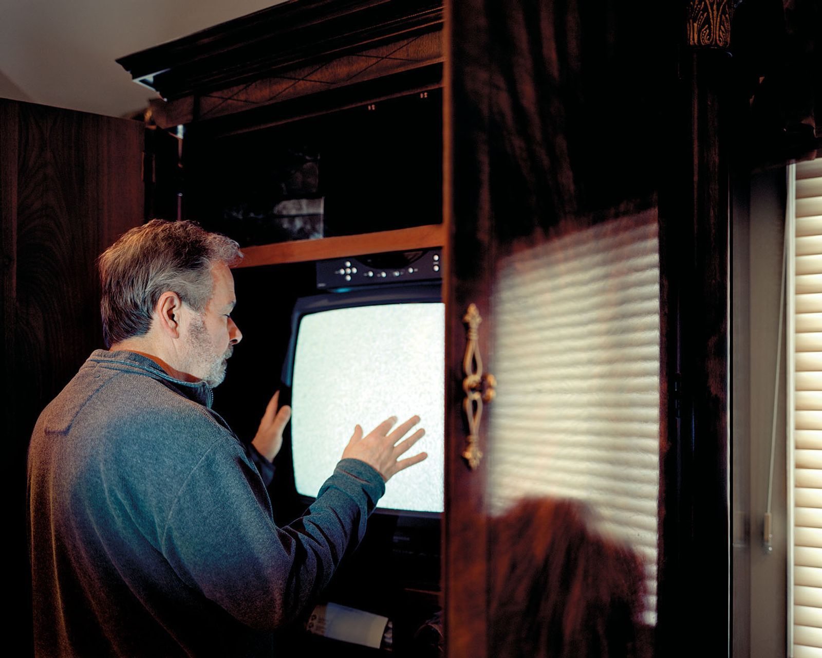 © Nicole Schwartz - Dad feels the static on the TV