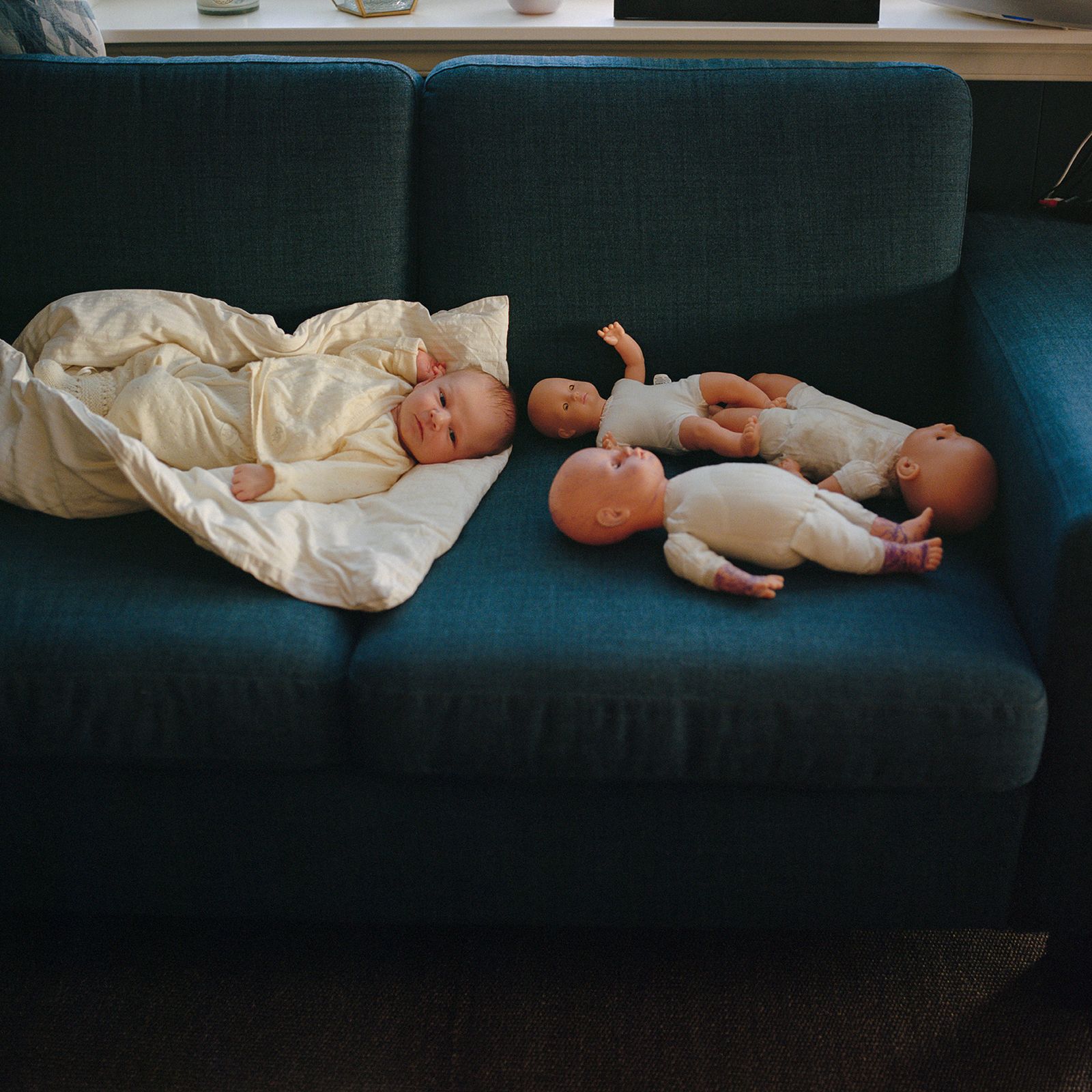 © Mirjam Stenevik - Luca is laying beside some freshly tattooed dolls, courtesy of his big sister Olivia.