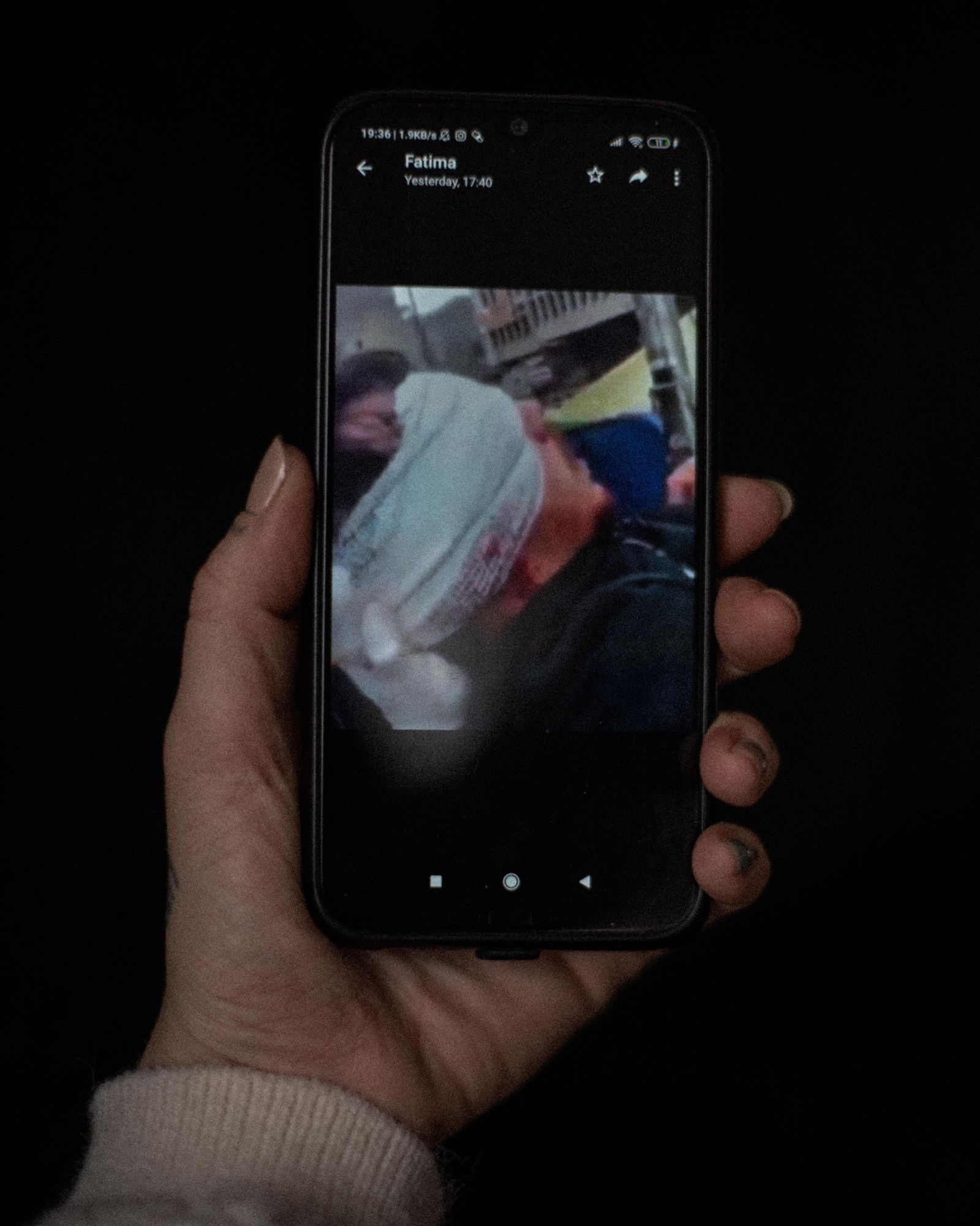 © Chloe Sharrock - A picture of Fatima's boyfriend on his death bed, after being fatally shot during the 2019 protests in Baghdad, Iraq.