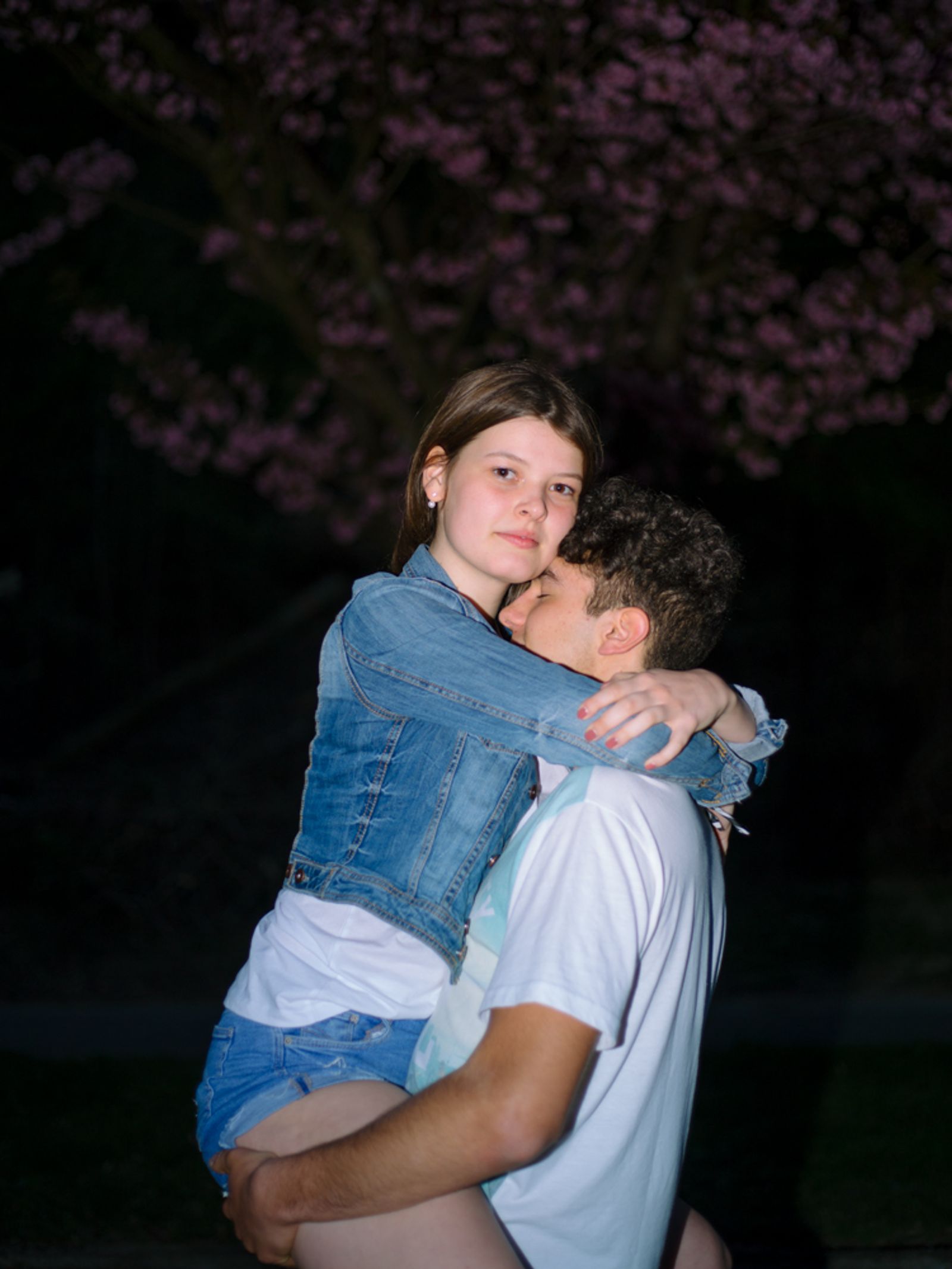 © Lea Franke - "Lars carries Ronja on his arm in front of a blossoming cherry tree, Ronja's favorite flowers"
