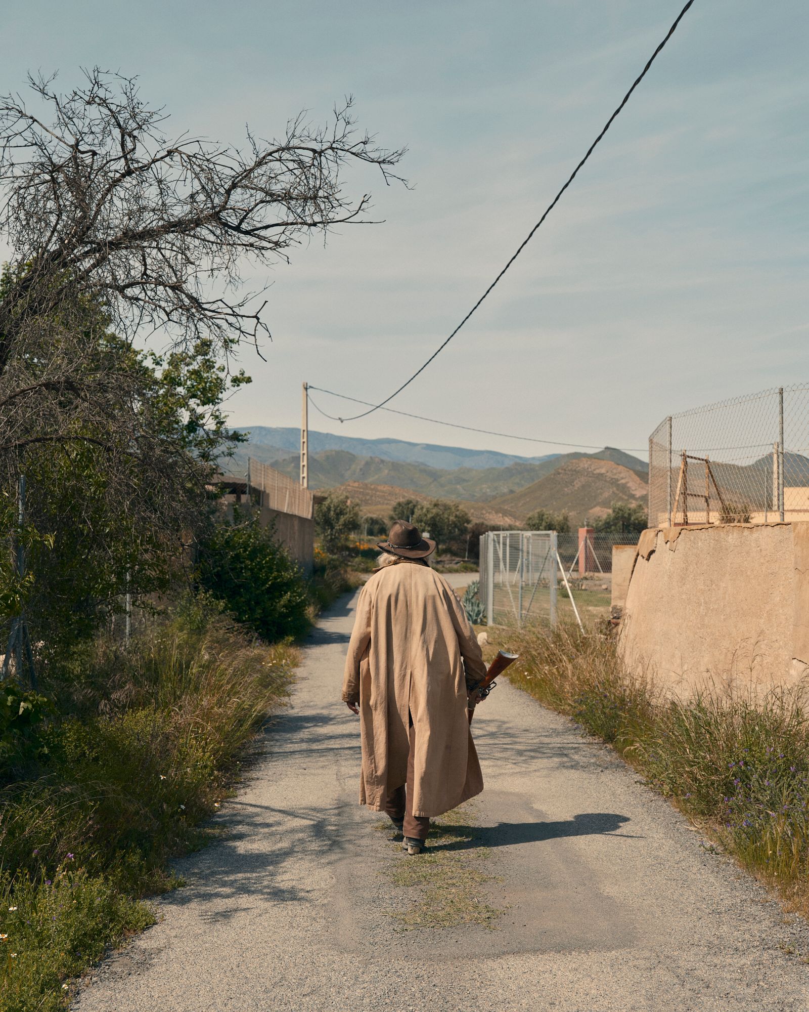 © Andrea Pugiotto - John, actor and stuntman wanders nearby his Sweetwater Ranch.