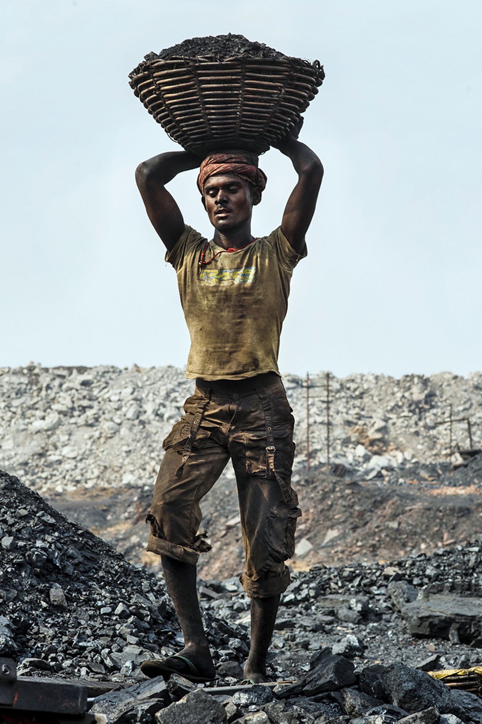 © Valerie Leonard - ATLASAt around 8 am, some of them are paid 1$ a day to load manually the coal in the trucks.