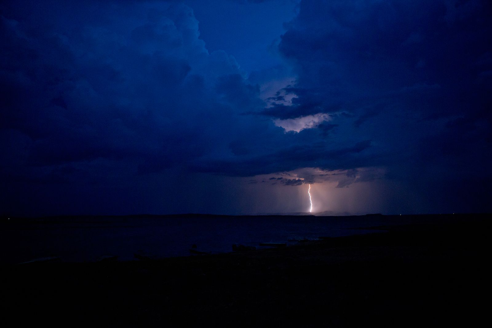 © Jono Terry - Thunderstorm over the flood plain, a welcome relief to our worst drought in over a decade. Malende work. NyamiNyami lives.