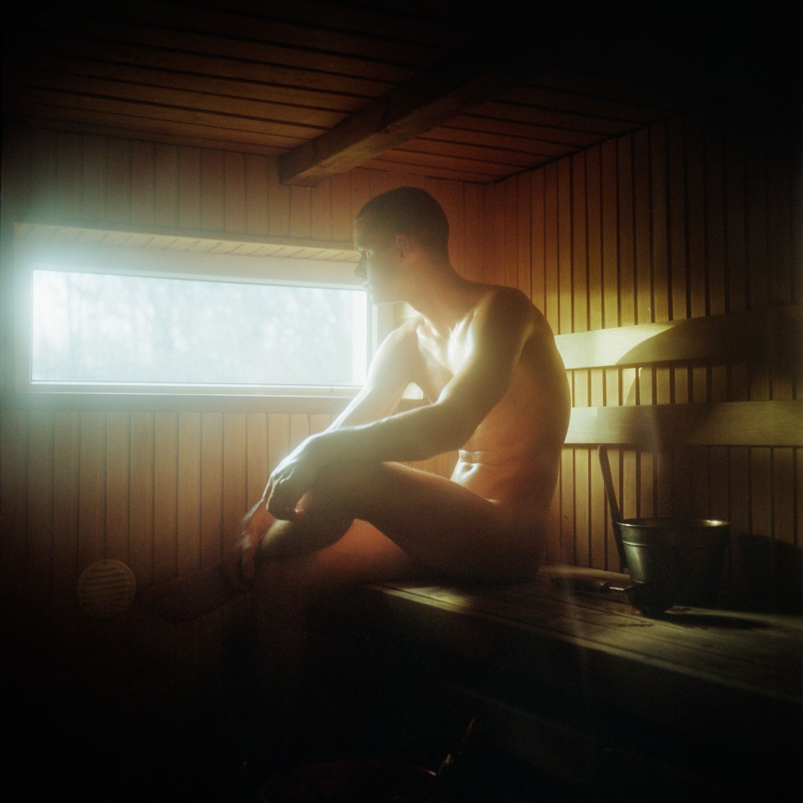 © Jérémie Jung - Martin rests in his sauna after helping his family to clean up the house before the long traditional Christmas celebrations.