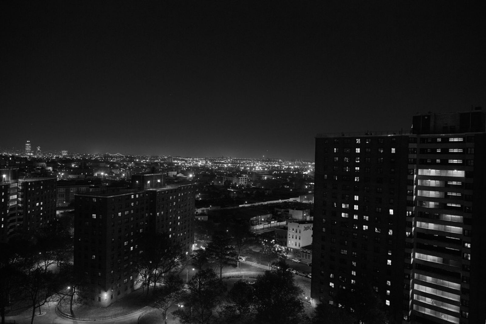 © Nicolas Enriquez - View of Manhattan at night from the top of one of the building at the Bushwick housing projects in Brooklyn.