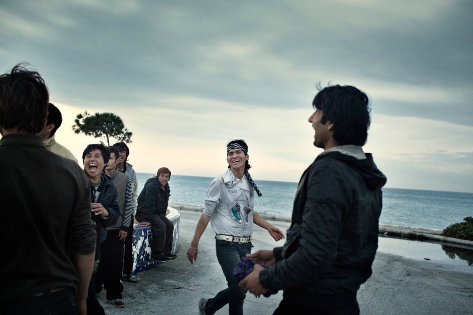 © Alessandro Penso - 2012. Patras . Greece. Young Afghans play near the Port of Patras.