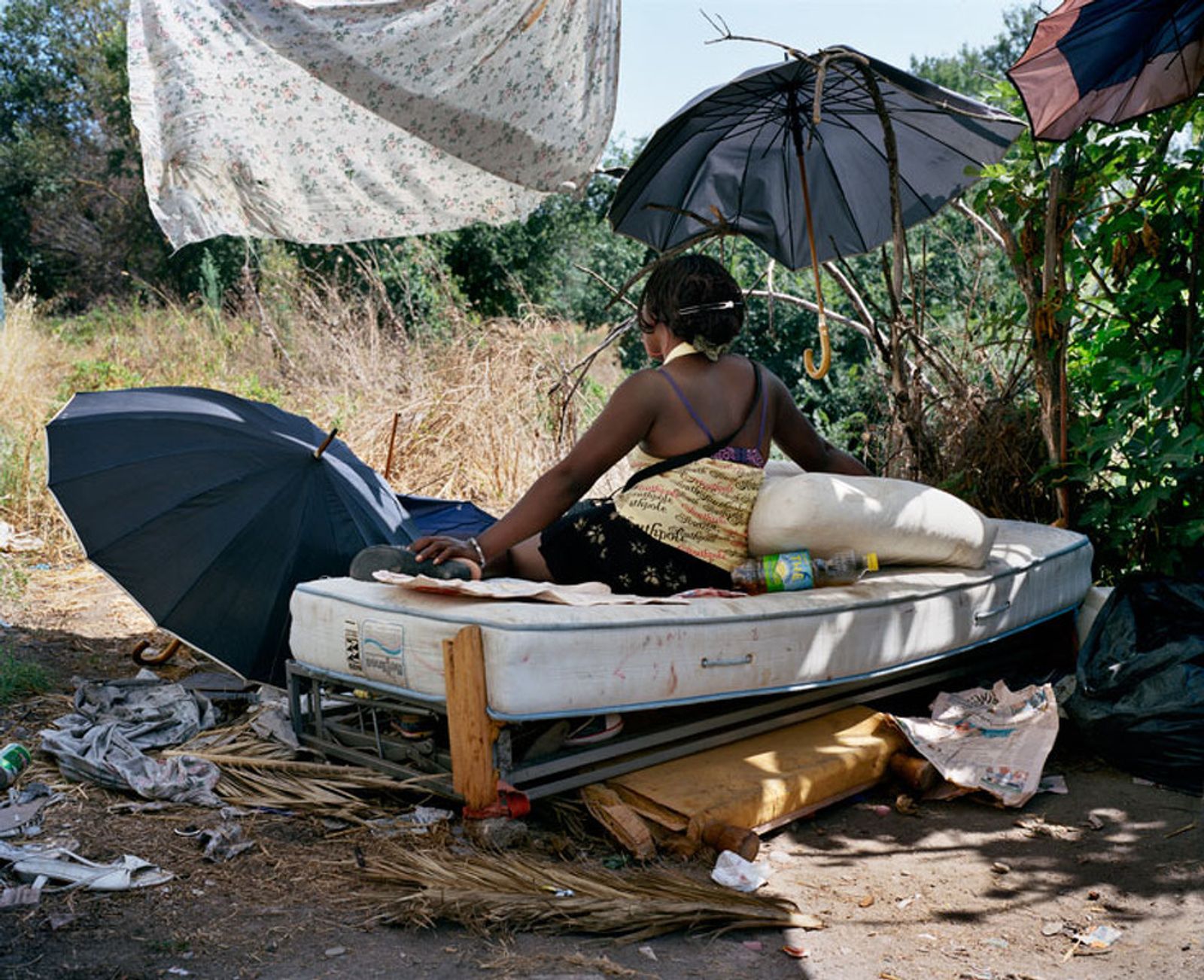 © Paolo Patrizi - Sharon, a sex worker, on her makeshift bed, Rome, Italy