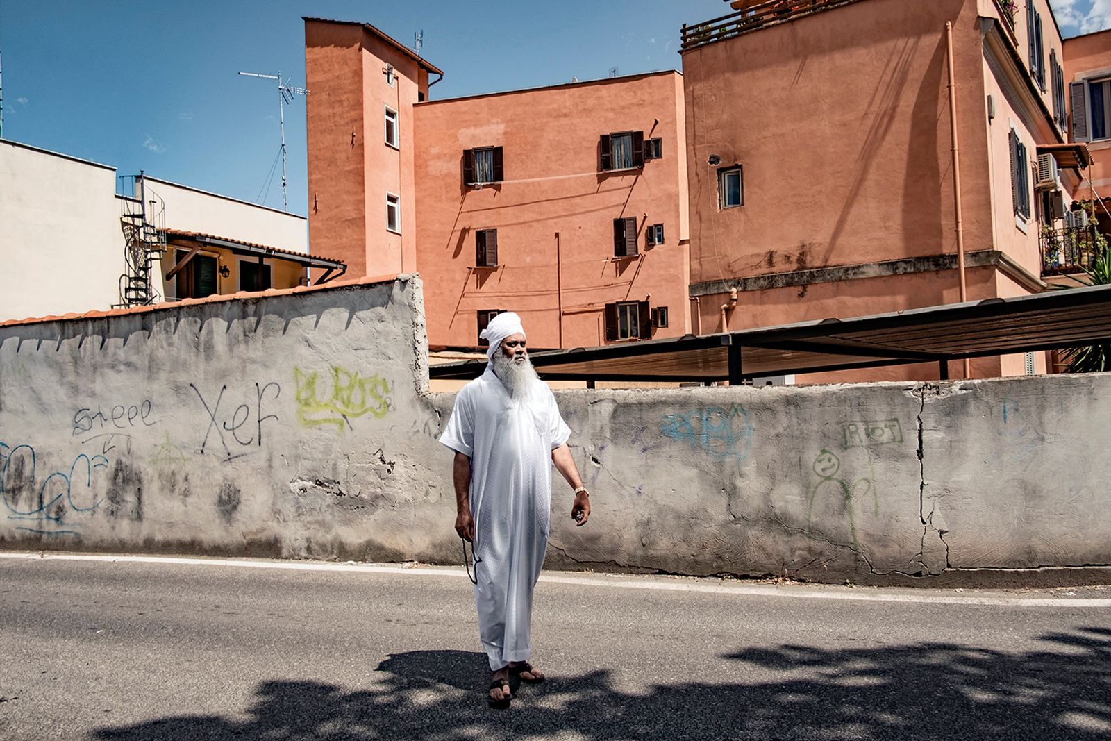 © Paolo Patrizi - A man on his way home after Friday prayer in the Pigneto neighbourhood in the eastern periphery of Rome.