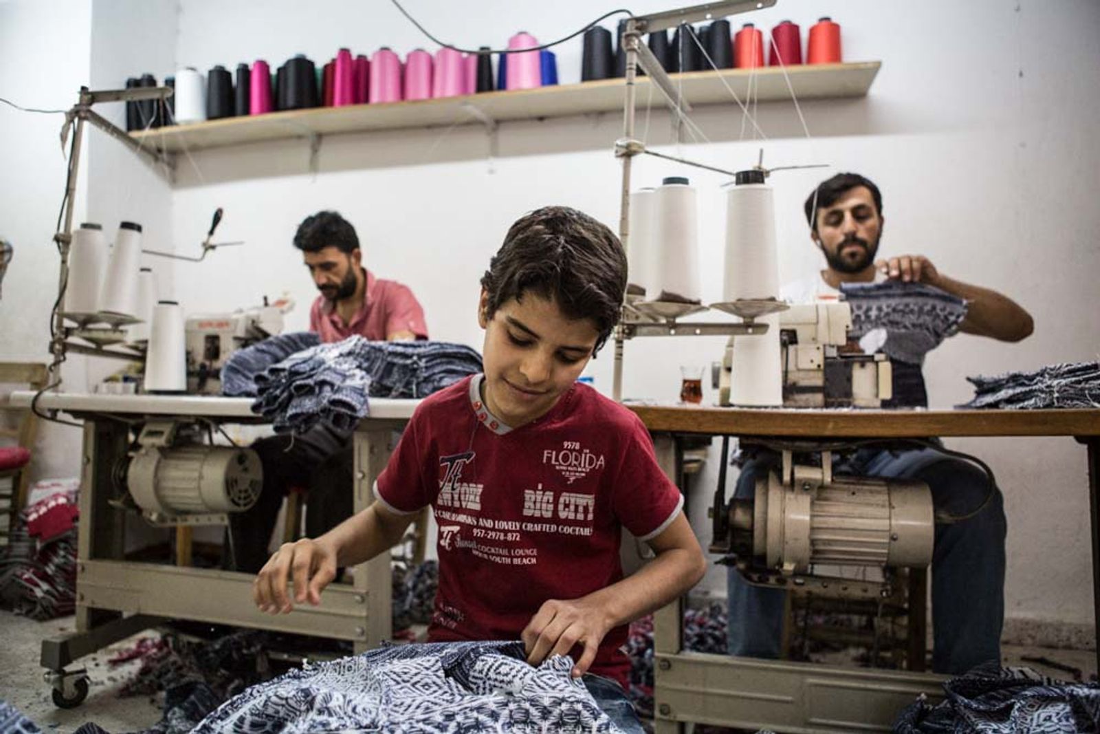 © Valerio Muscella - A Syrian boy works in a Turkish textile workshop in Gaziantep, Turkey. May 2016.