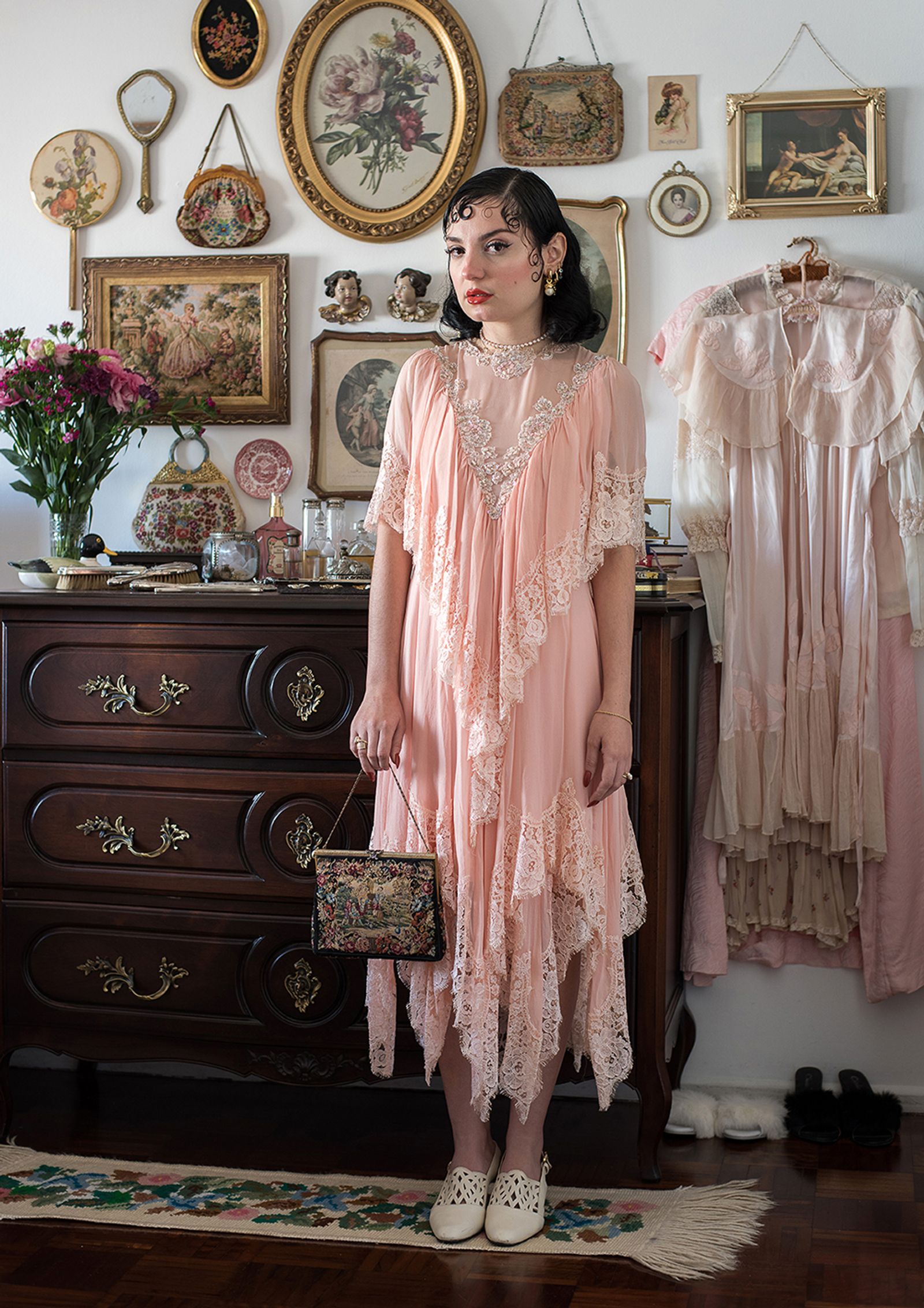 © Camila Falcão - Ligia, vintage clothing saleswoman, poses wearing one of her favorite vintage dresses