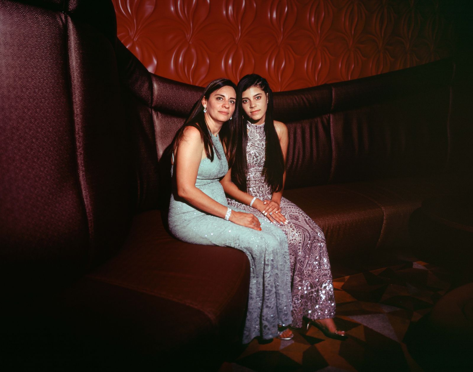 © Samantha Cabrera Friend - Quinceañera Natalie Gonzalez and her mother Liudmila Sarmiento pose before the dinner, the day after their celebration.