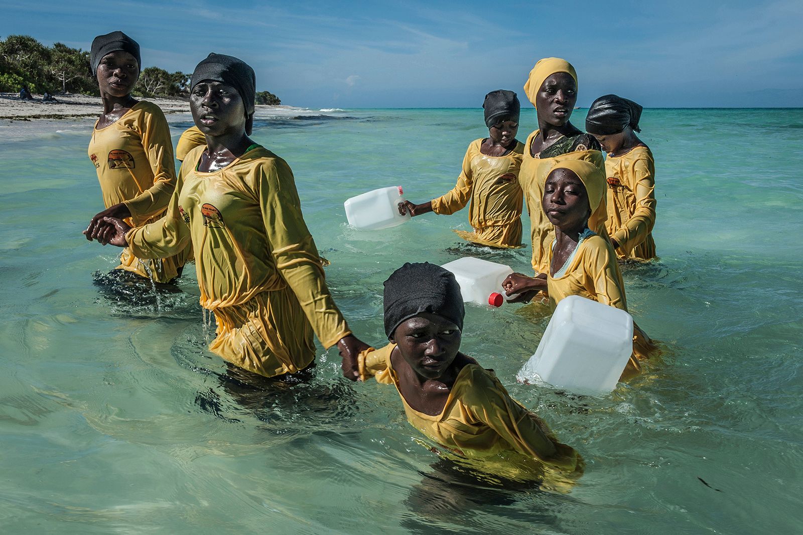 © Anna Boyiazis - Kijini Primary School students walk to shore after their lesson in the Indian Ocean off of Muyuni, Zanzibar.