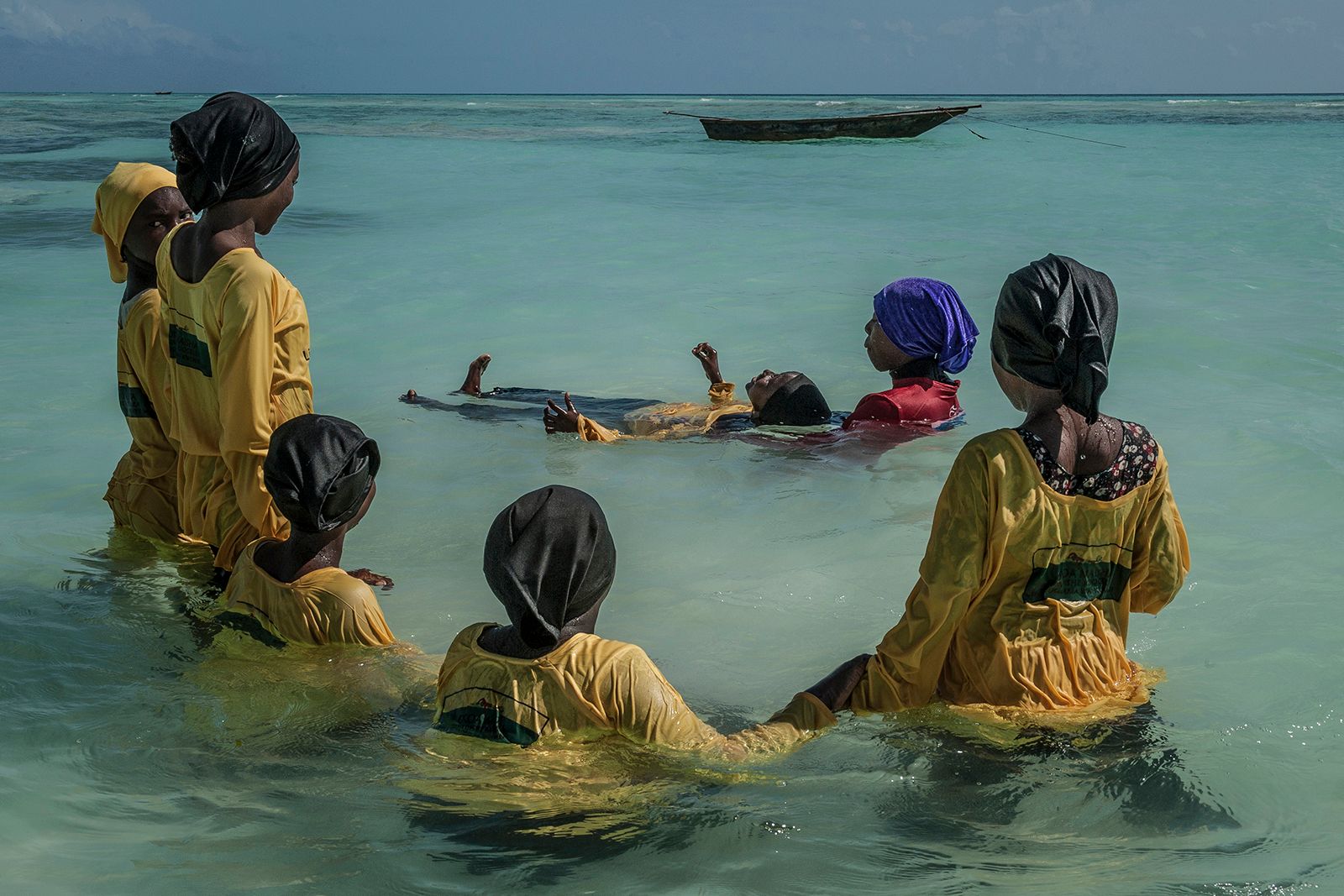 © Anna Boyiazis - Swim instructor Kazija, 22, teaches Kijini Primary School students how to float in the Indian Ocean off of Muyuni, Zanzibar.