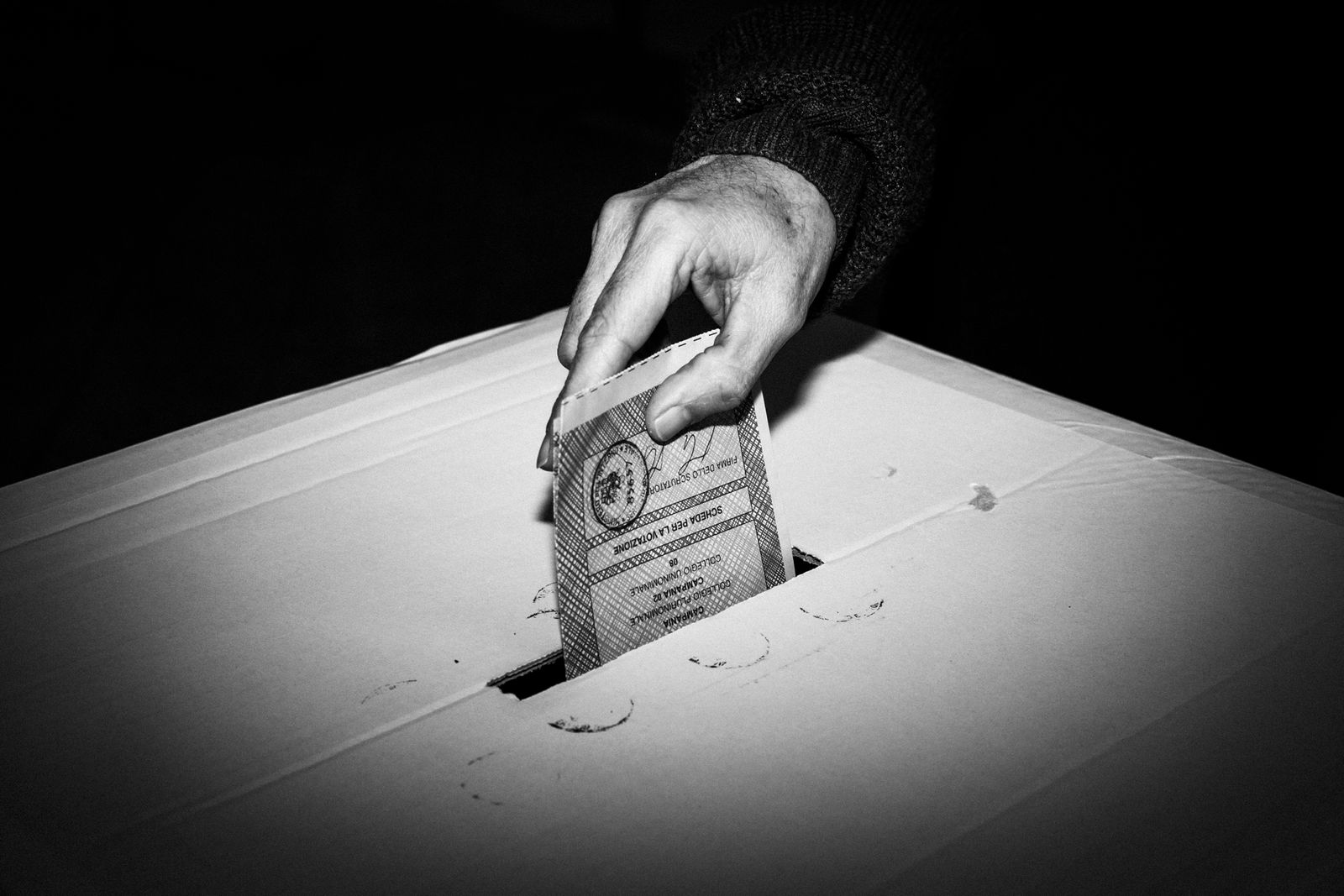 © Gianni Cipriano - An Italian voter casts a ballot in Naples.