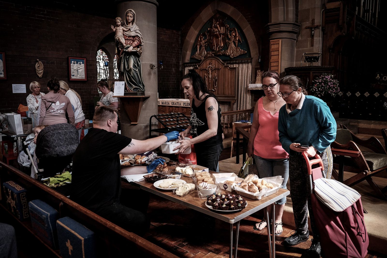 © Mary Turner - People in need come to collect free food and get a hot meal at a food bank in Hartlepool.