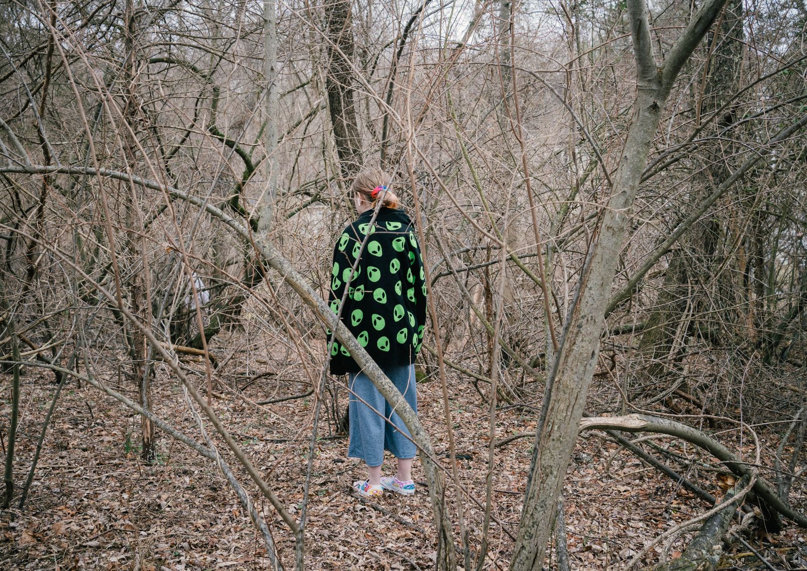 © Paola Chapdelaine - Silent’s niece, Autumn, among the trees surrounding their family house.