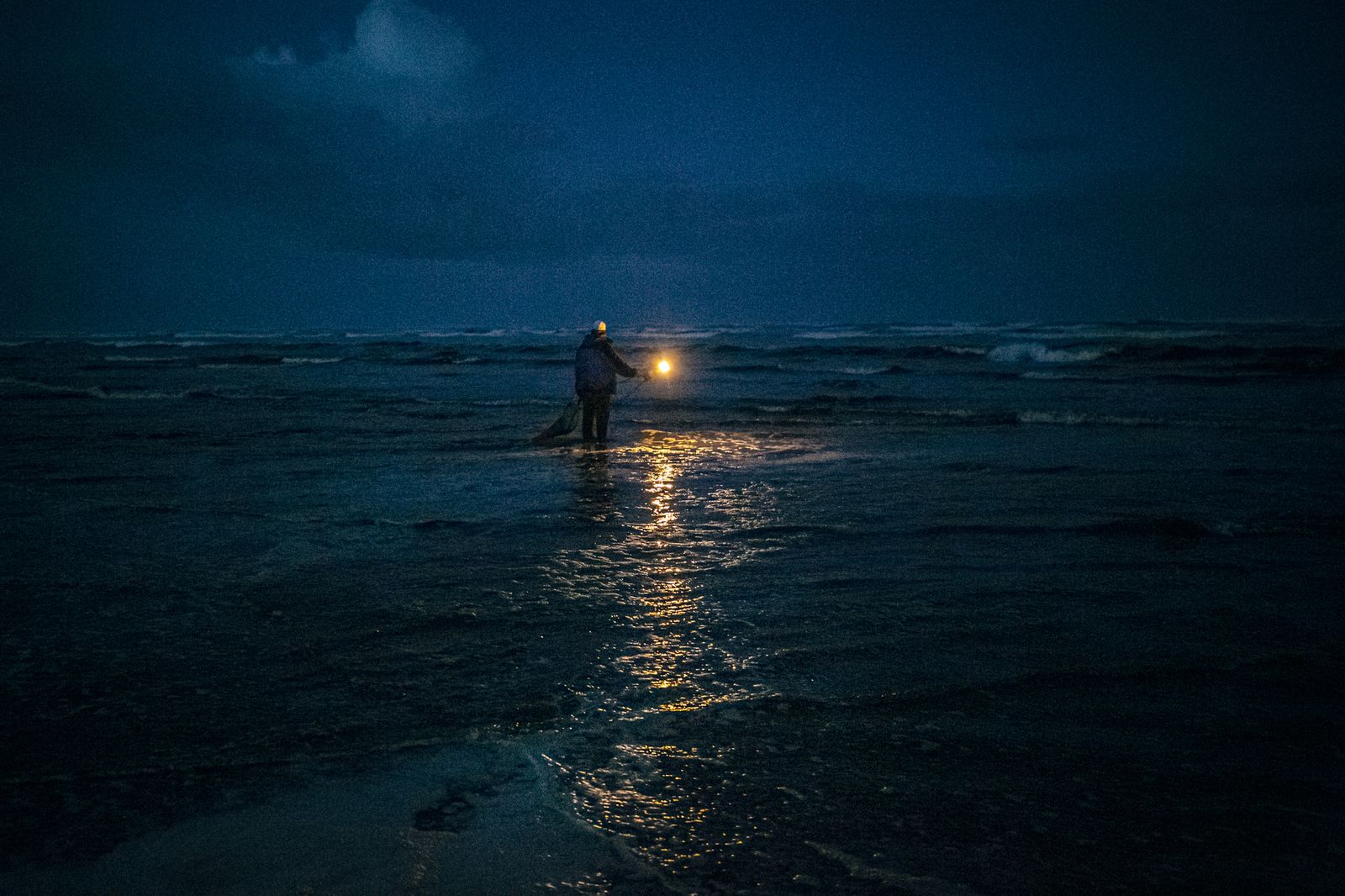 © Michael Snyder - A Quinault Indian leader looks out into the Pacific Ocean before sunrise.