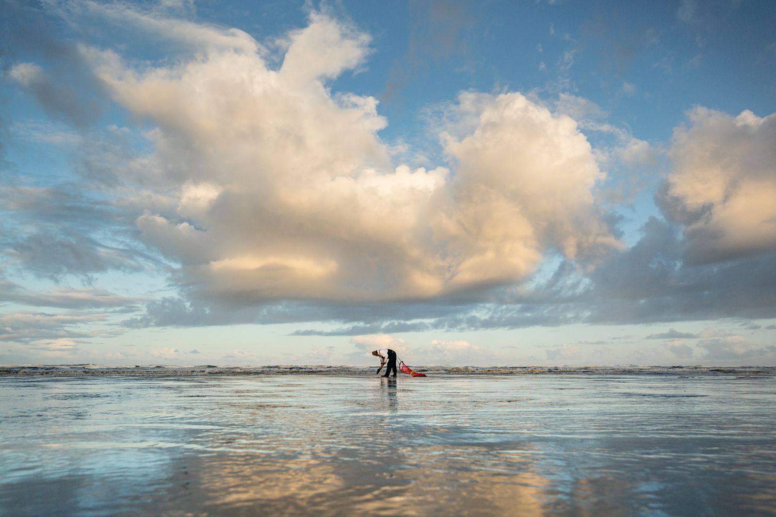 © Michael Snyder - A lone Quinault Indian hunts for razor clams at dawn.